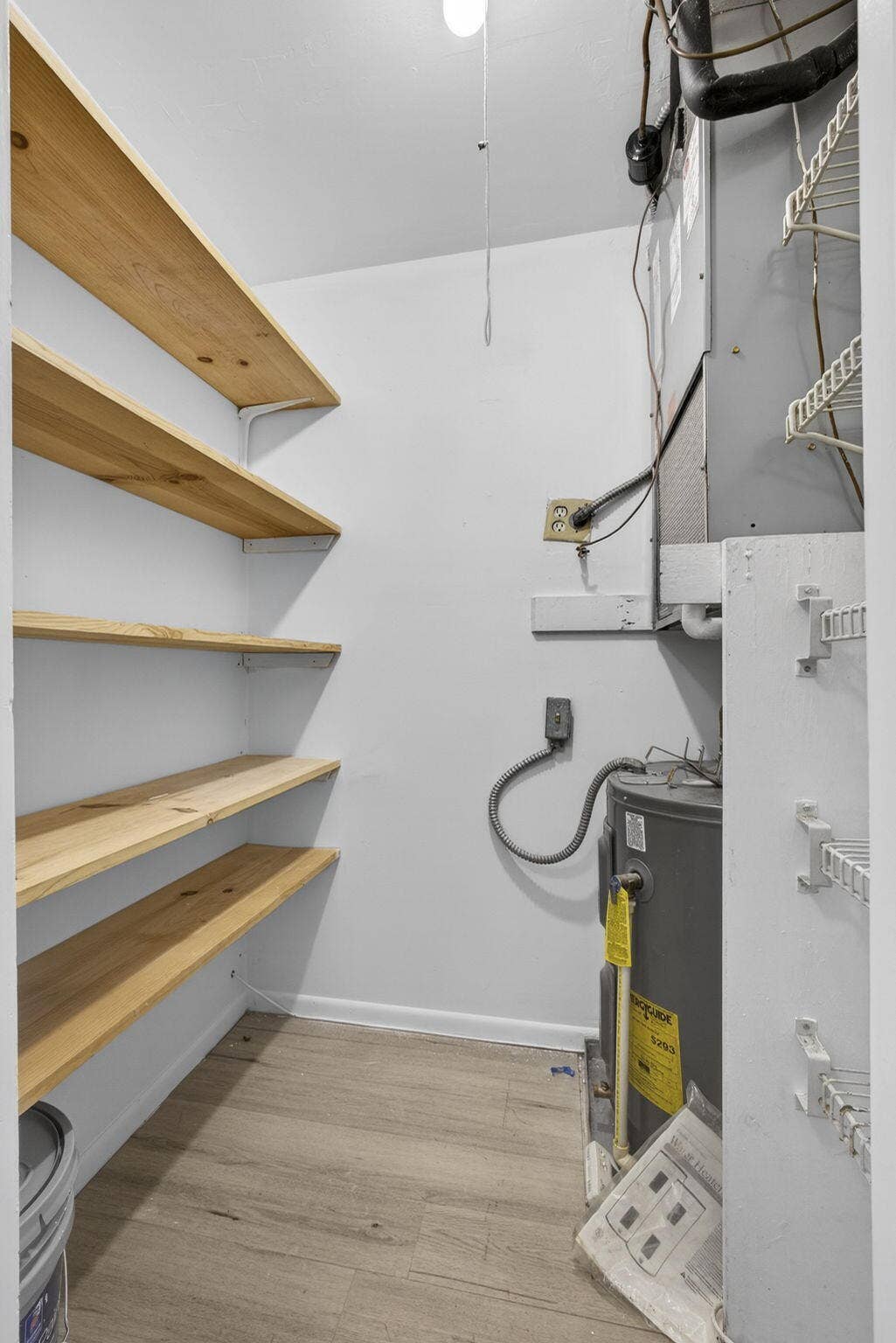 100 Shore Court, #307, North Palm Beach, FL 33408 utility closet with pantry storage