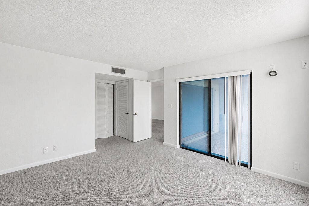 Primary bedroom with balcony