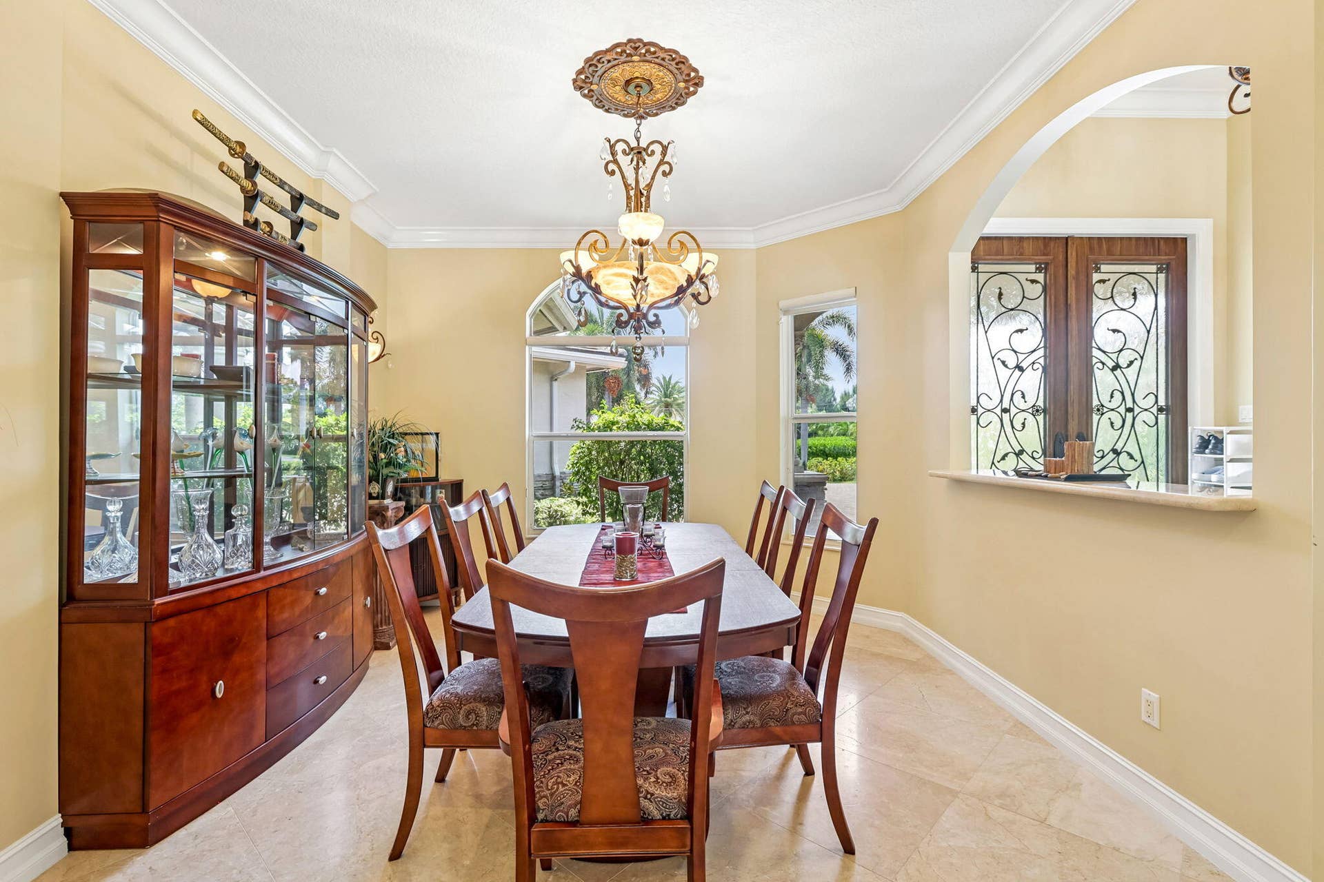 Formal dining area featuring neutral wall tones and tile flooring