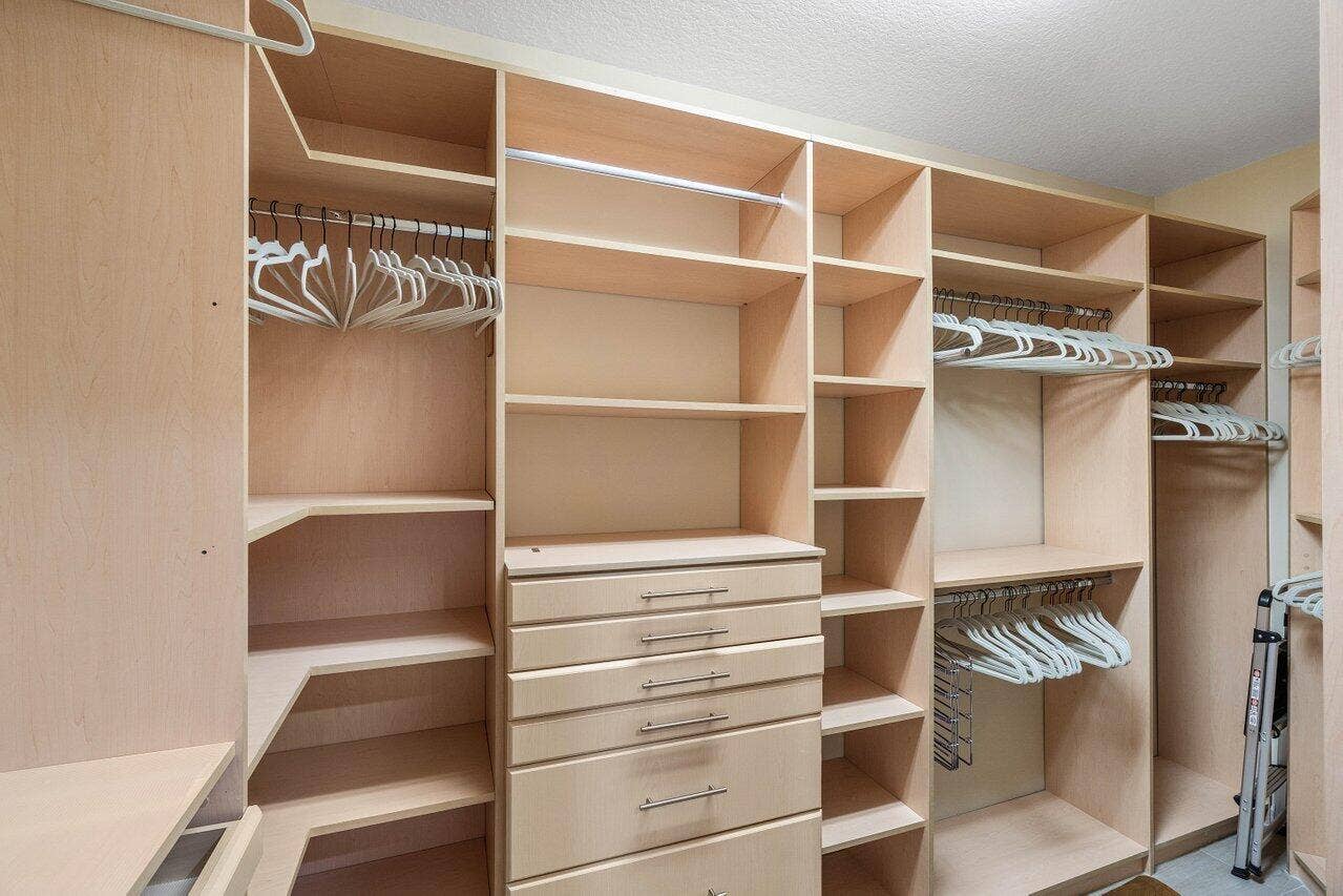 TWO WALK IN CUSTOM CLOSETS