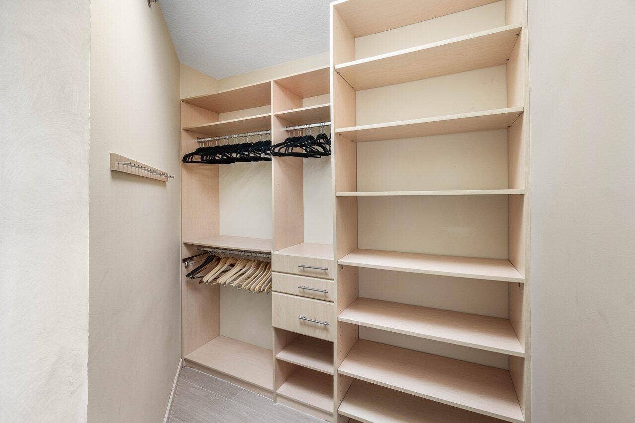 TWO WALK IN CUSTOM CLOSETS