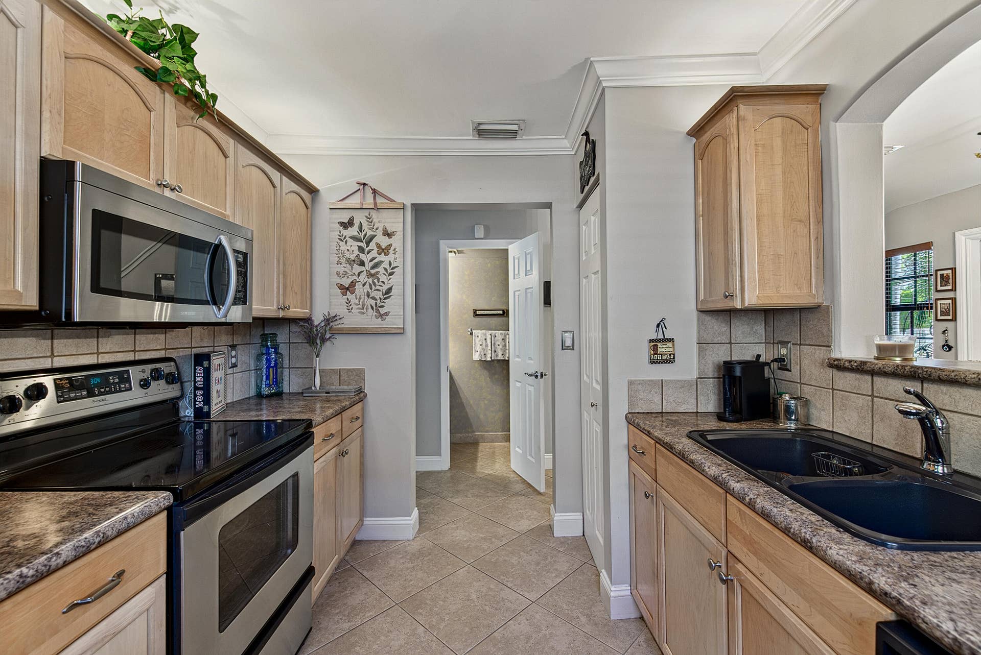 2130 NE 9th Avenue, Wilton Manors, FL 33305 Half Bath in hallway off of kitchen