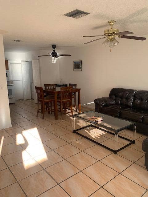 933 Francis Street, West Palm Beach, FL 33405 Open-concept living area with large format tile flooring