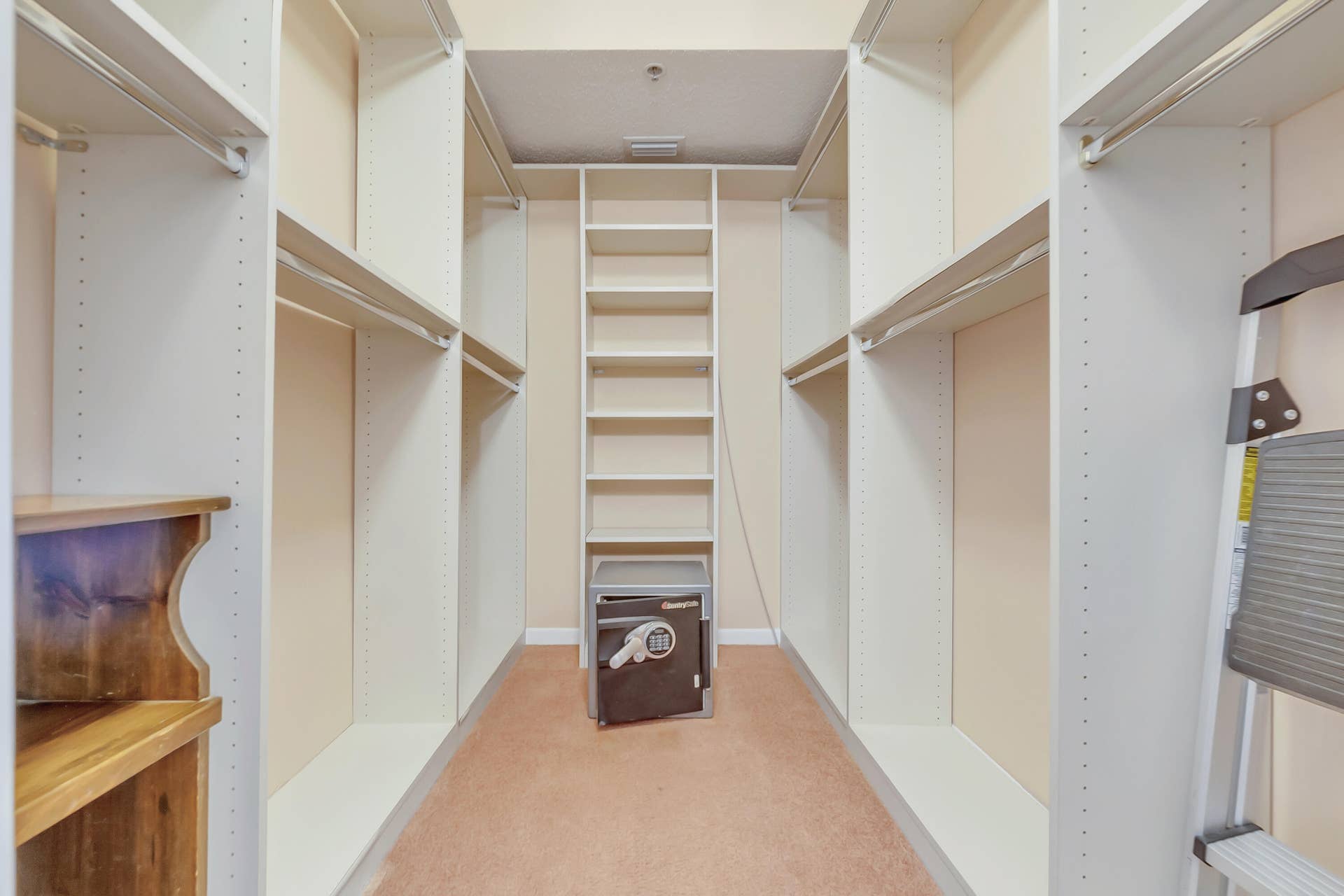 2334 S Cypress Bend Drive, #602, Pompano Beach, FL 33069 Custom closet system featuring multiple shelving units and hanging rods