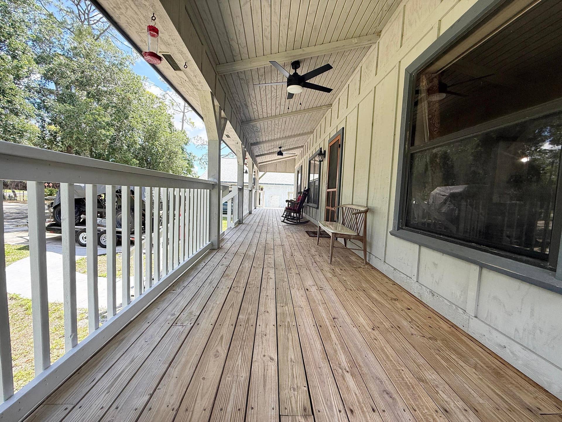 The front porch of your dreams - Enjoy the occasional breeze, butterflies and birds.