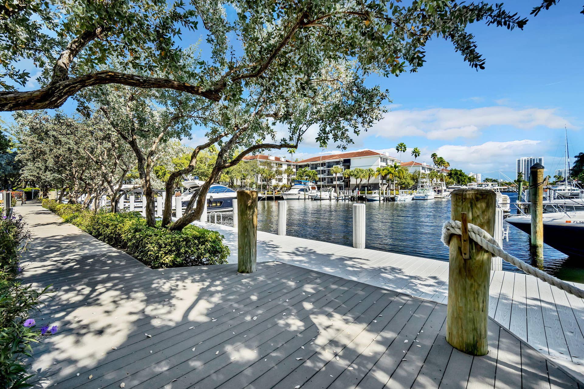 3200 Port Royale Drive N, #902, Fort Lauderdale, FL 33308 Waterfront boardwalk with a marine rope railing and multiple boat slips