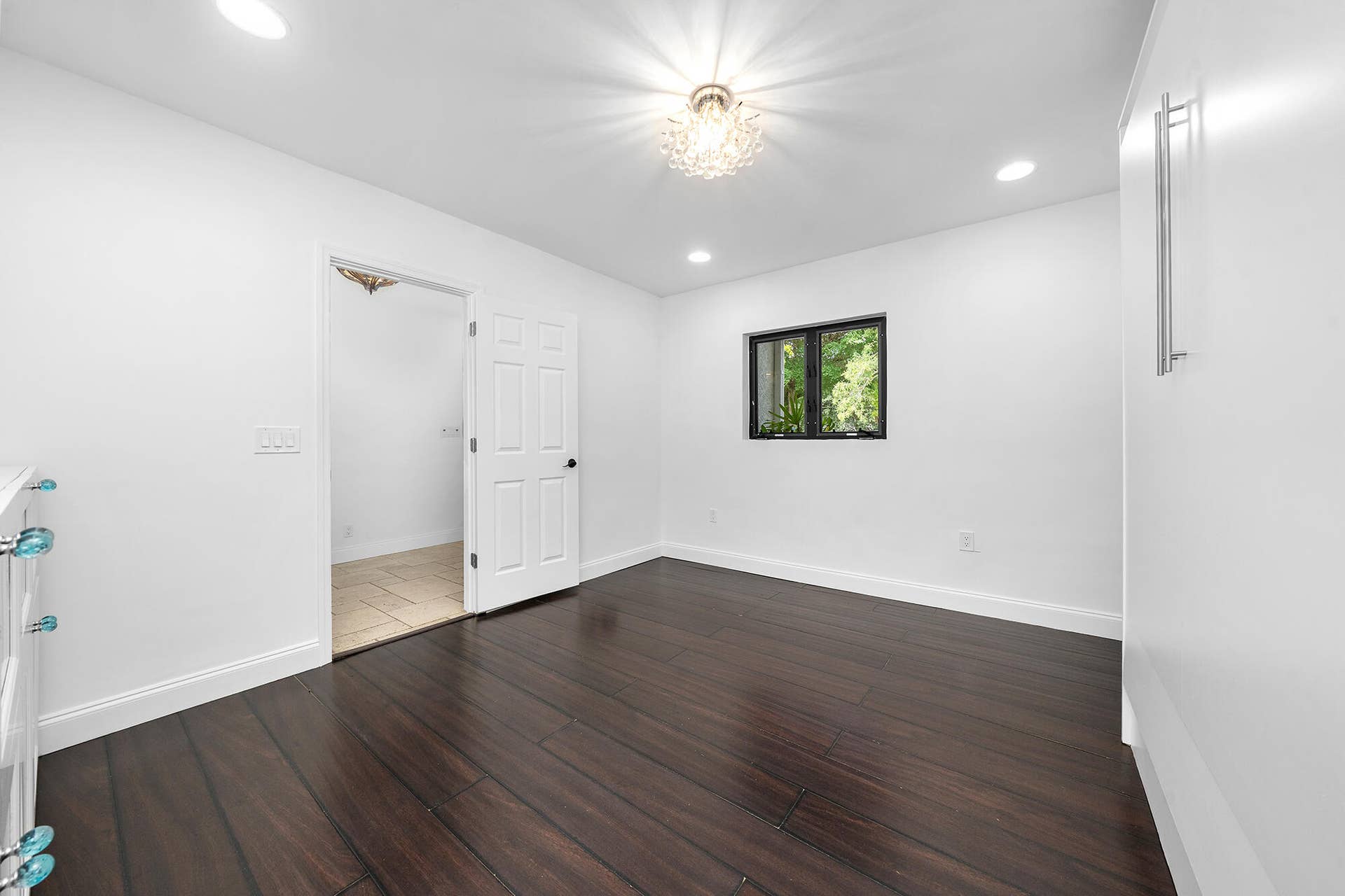 4950 Thoroughbred Lane, Southwest Ranches, FL 33330 Room featuring dark wood-finish flooring, recessed lighting, and a decorative ceiling fixture