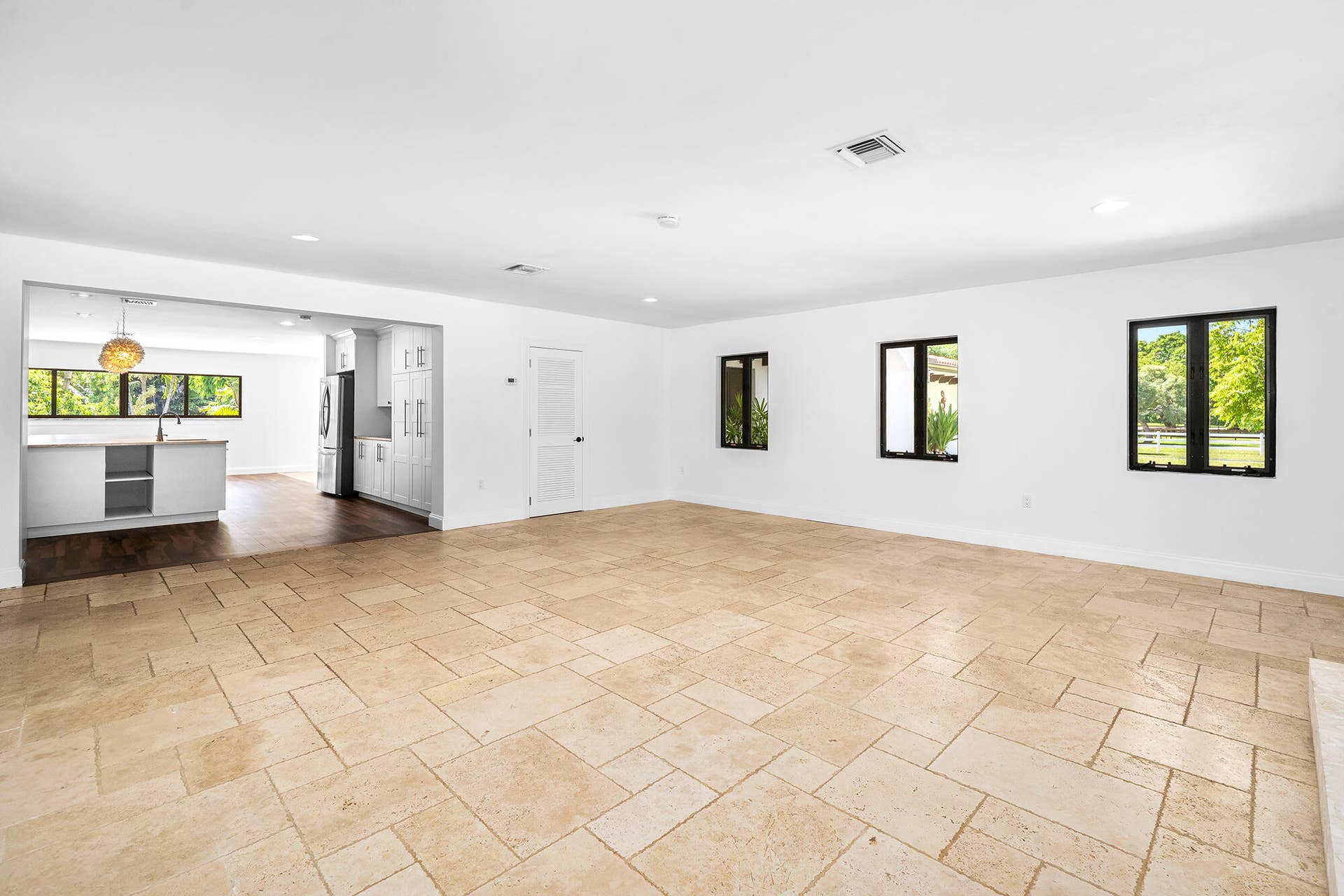 4950 Thoroughbred Lane, Southwest Ranches, FL 33330 Family Room with fireplace and travertine marble floor