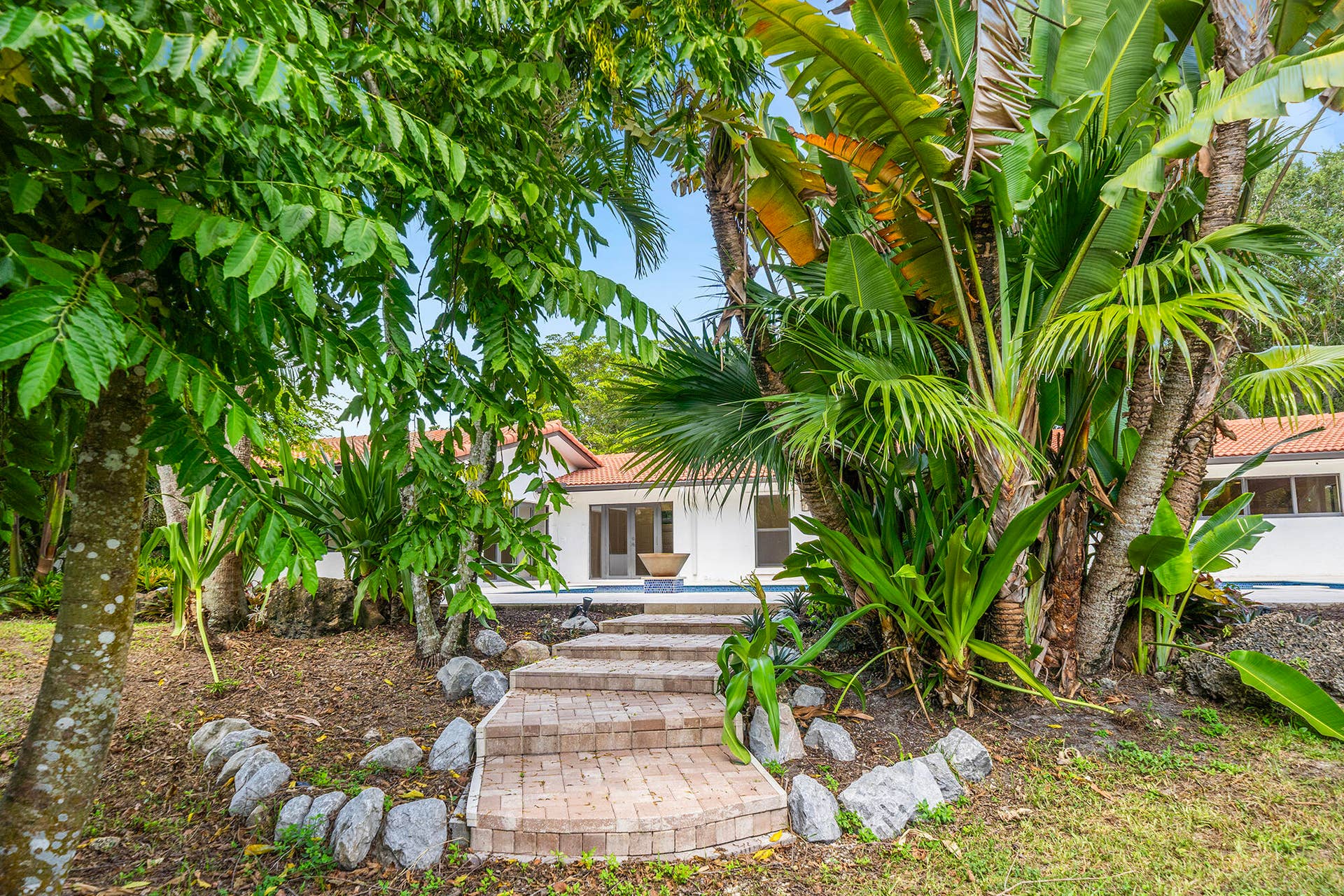 4950 Thoroughbred Lane, Southwest Ranches, FL 33330 Brick paver pathway with from patio to backyard