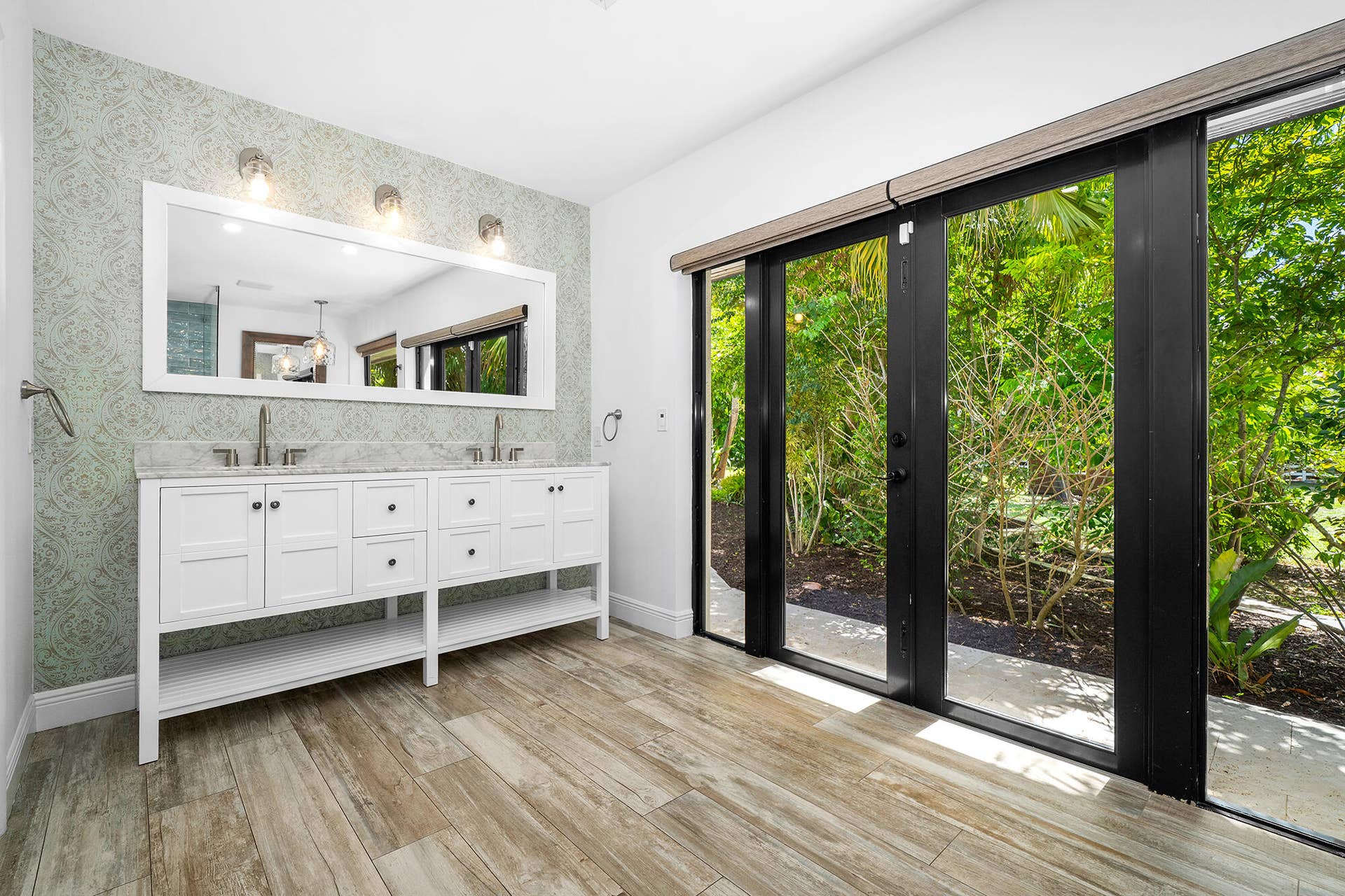4950 Thoroughbred Lane, Southwest Ranches, FL 33330 Dual vanity with white cabinetry, light-toned countertop, and undermount sinks