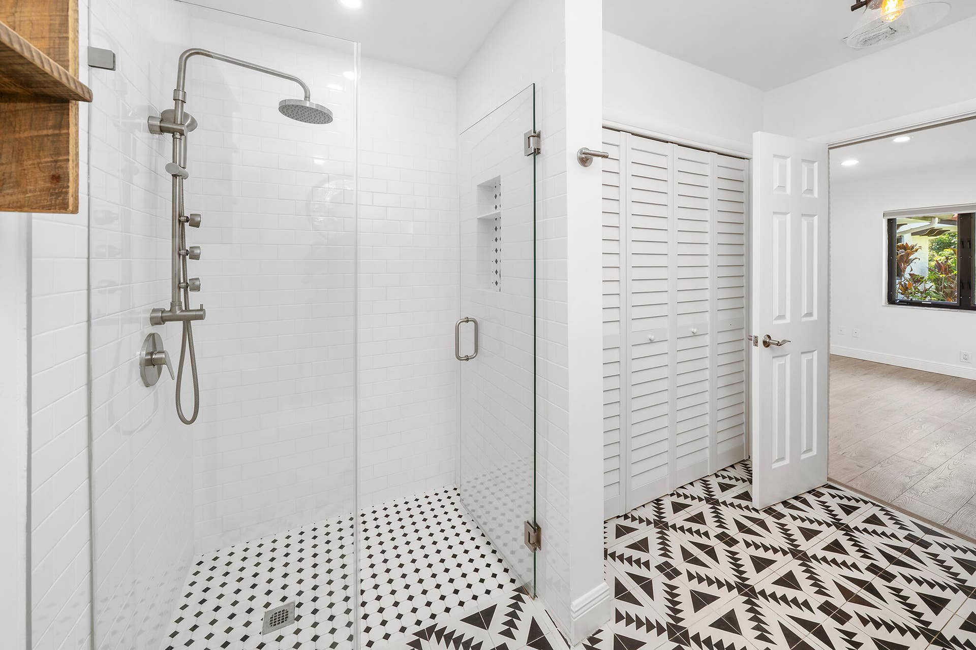 4950 Thoroughbred Lane, Southwest Ranches, FL 33330 Walk-in shower with clear glass enclosure and hexagon mosaic tile flooring