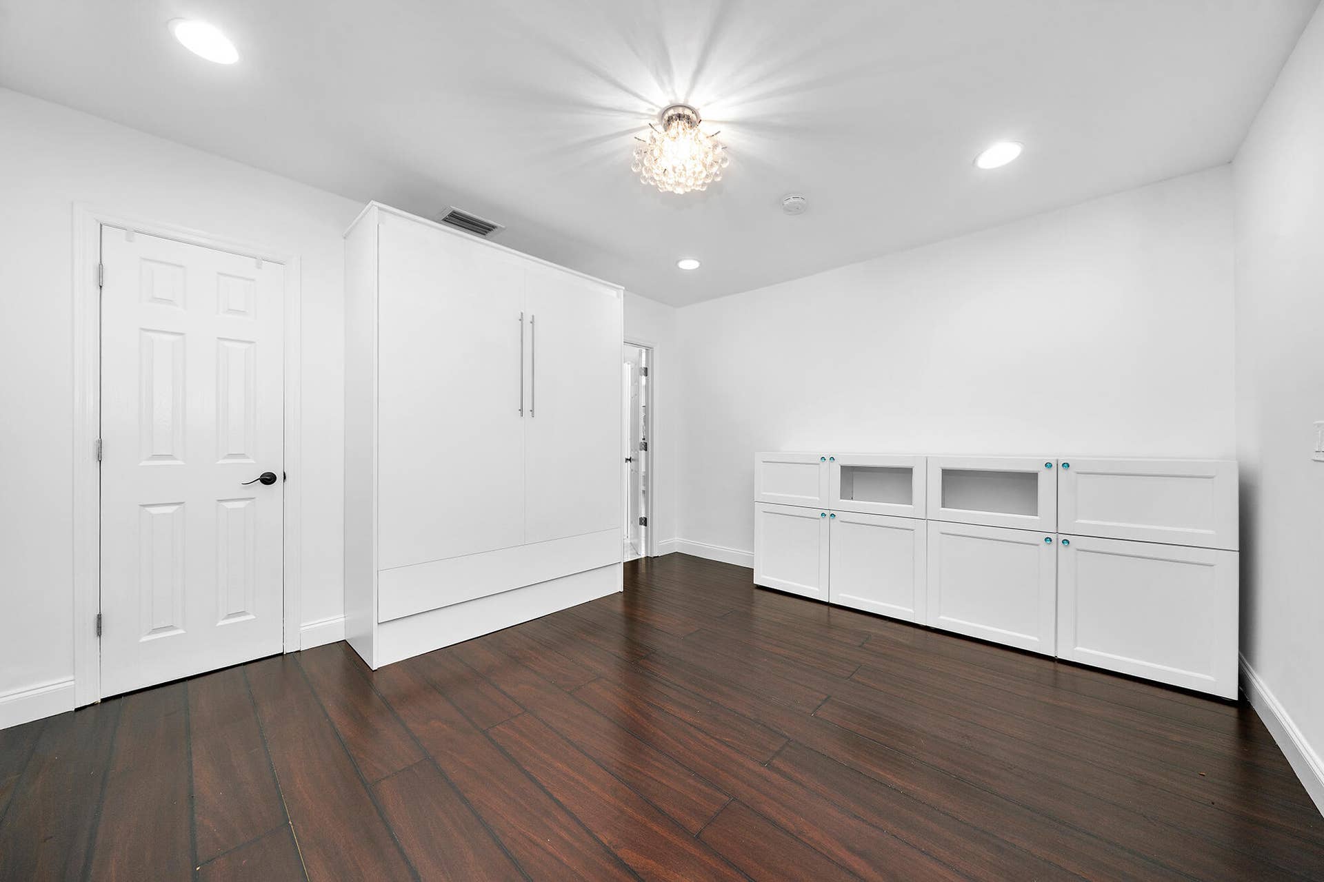 4950 Thoroughbred Lane, Southwest Ranches, FL 33330 Room featuring dark wood-finish flooring, white walls, and a recessed ceiling light
