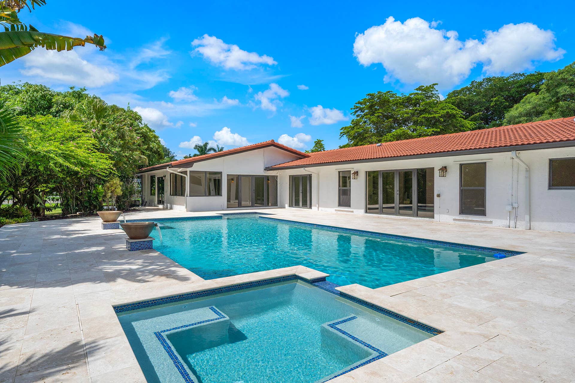 4950 Thoroughbred Lane, Southwest Ranches, FL 33330 Spacious outdoor area featuring a swimming pool, integrated spa, and expansive patio