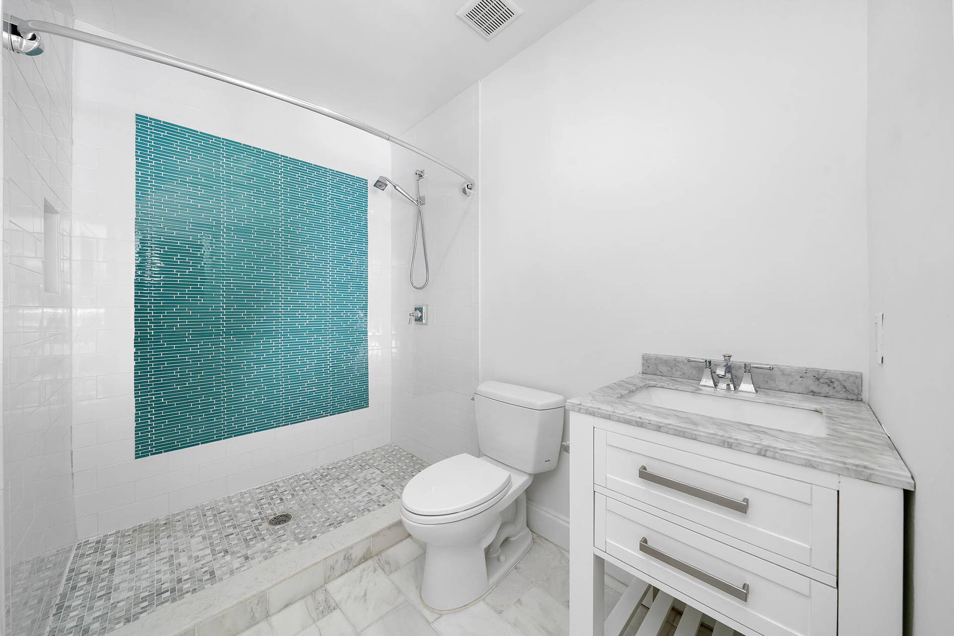 4950 Thoroughbred Lane, Southwest Ranches, FL 33330 Full bathroom featuring a walk-in shower with a patterned teal accent wall and glass enclosure