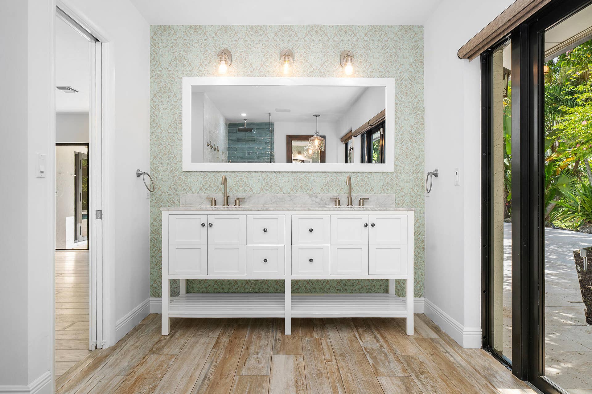4950 Thoroughbred Lane, Southwest Ranches, FL 33330 Dual vanity with white cabinetry, a light-toned countertop, and brushed nickel fixtures