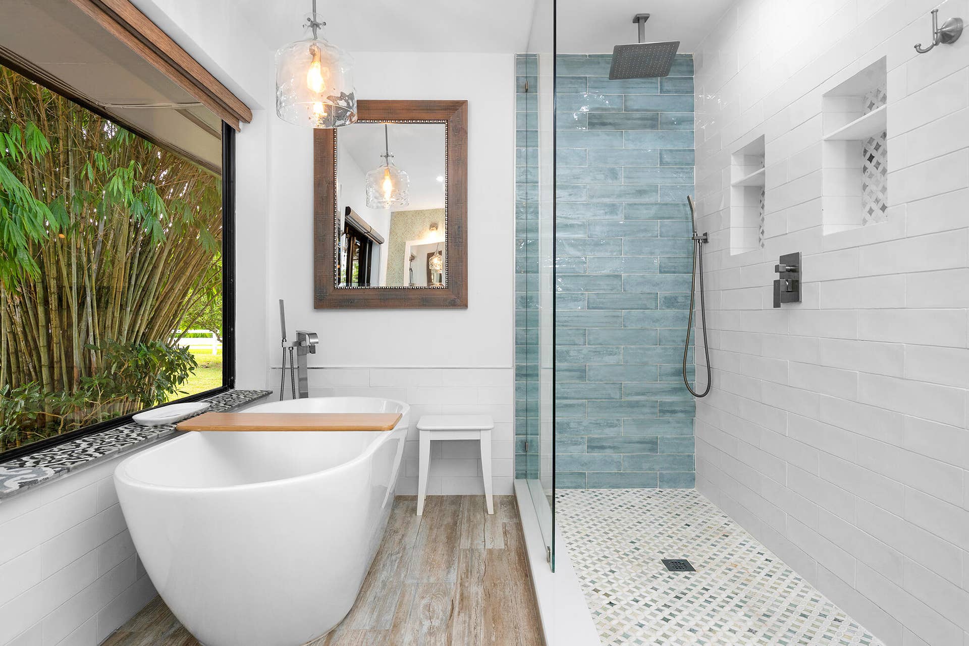 4950 Thoroughbred Lane, Southwest Ranches, FL 33330 Contemporary bathroom featuring a freestanding soaking tub, expansive window, glass-enclosed shower with rain head, patterned shower floor, and wall-mounted shelving