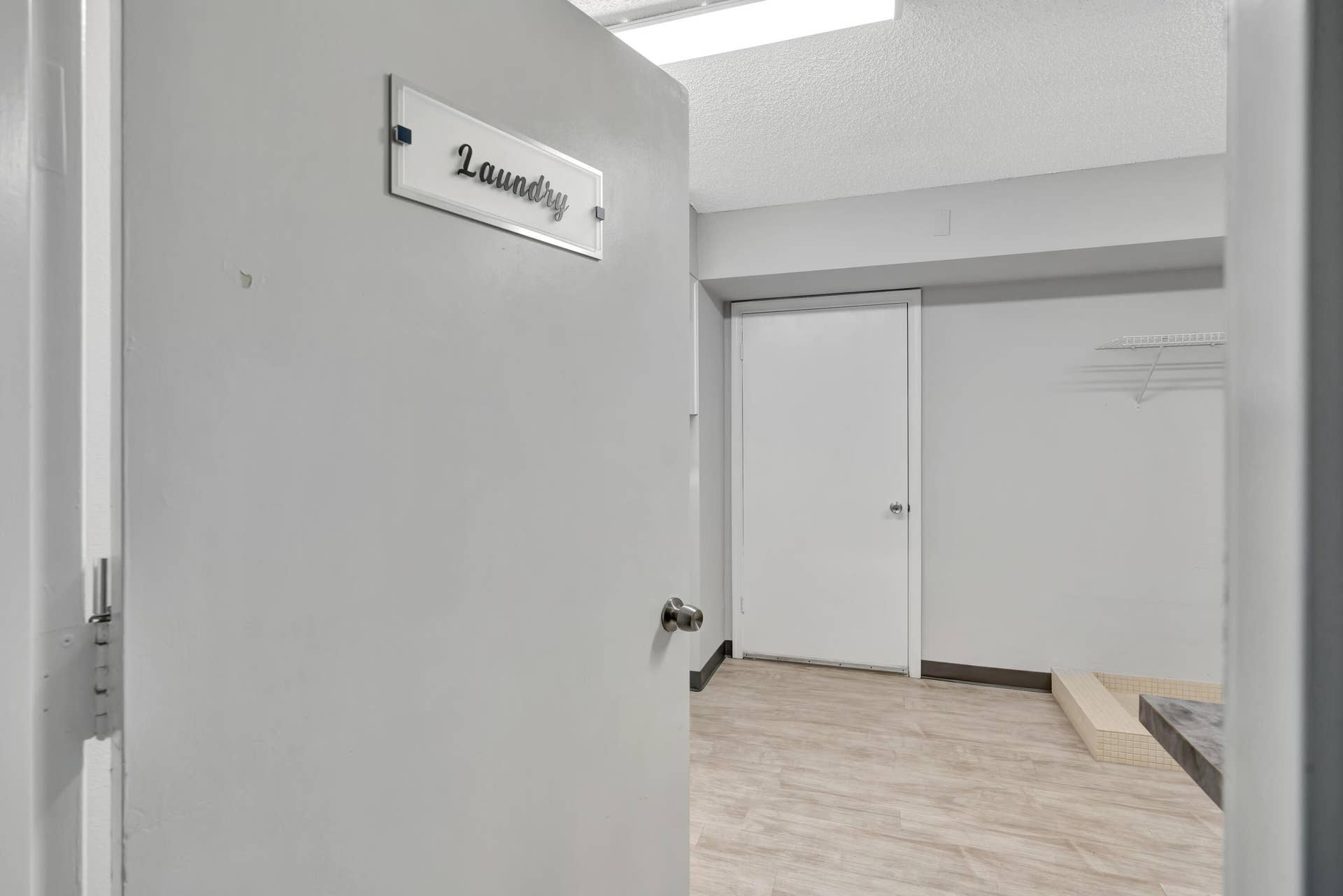 On FLoor Laundry with 2 washers 2 dryers storage and wash station