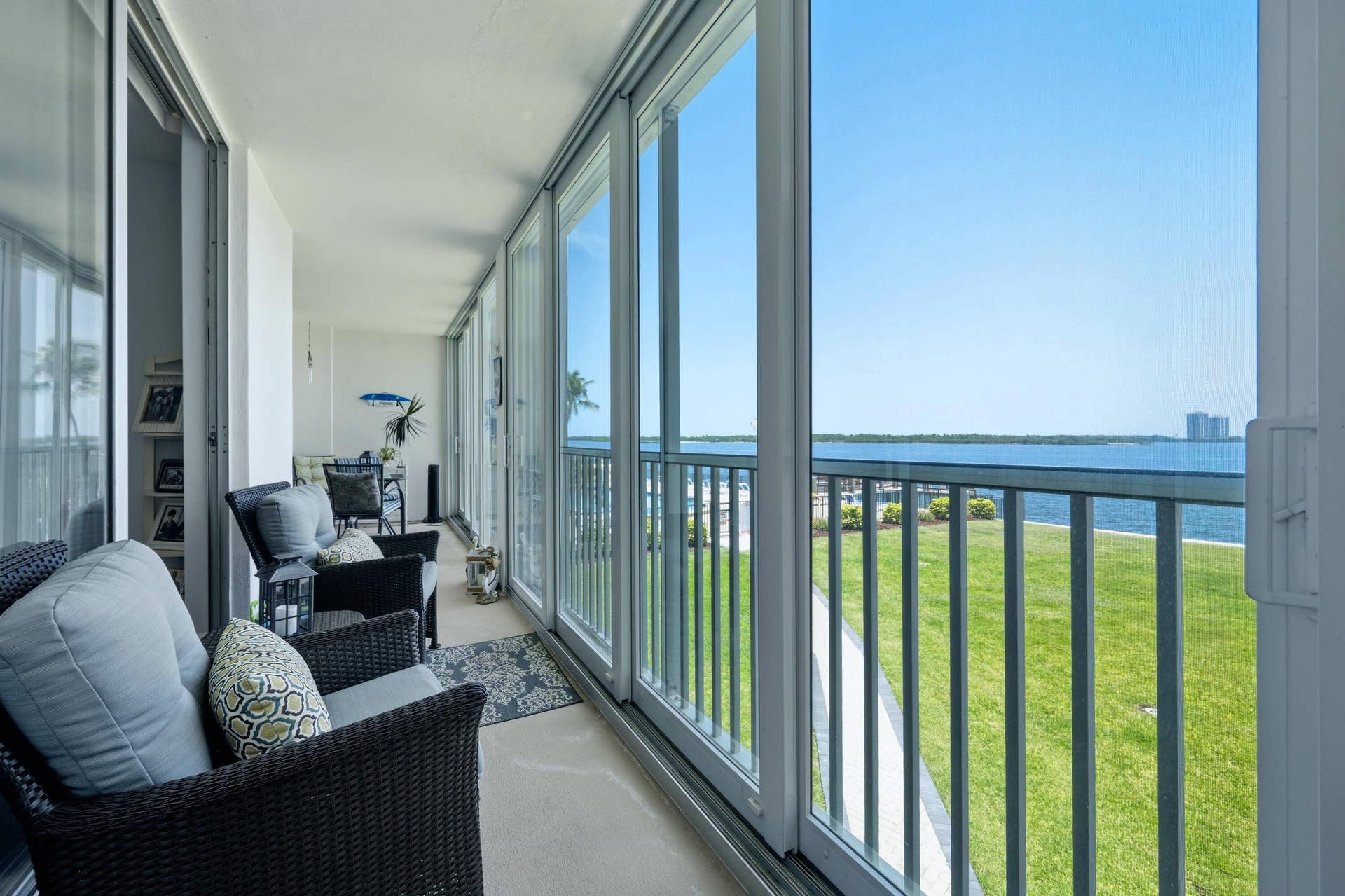 100 Paradise Harbour Boulevard, #203, North Palm Beach, FL 33408 Full porch view