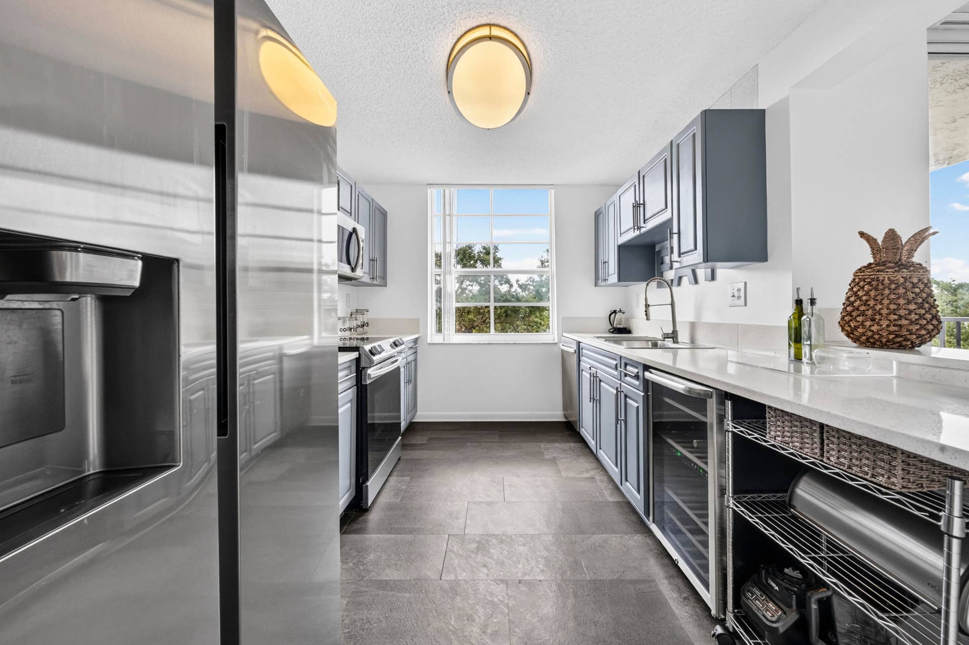 Updated kitchen featuring quartz countertops, stainless steel appliances, and modern finishes.