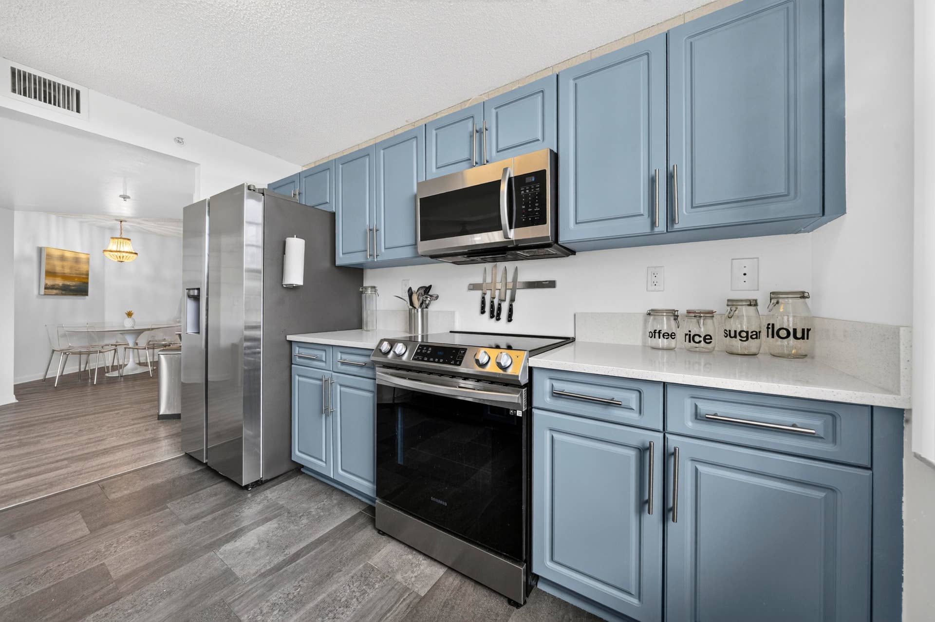 Updated kitchen featuring quartz countertops, stainless steel appliances, and modern finishes.