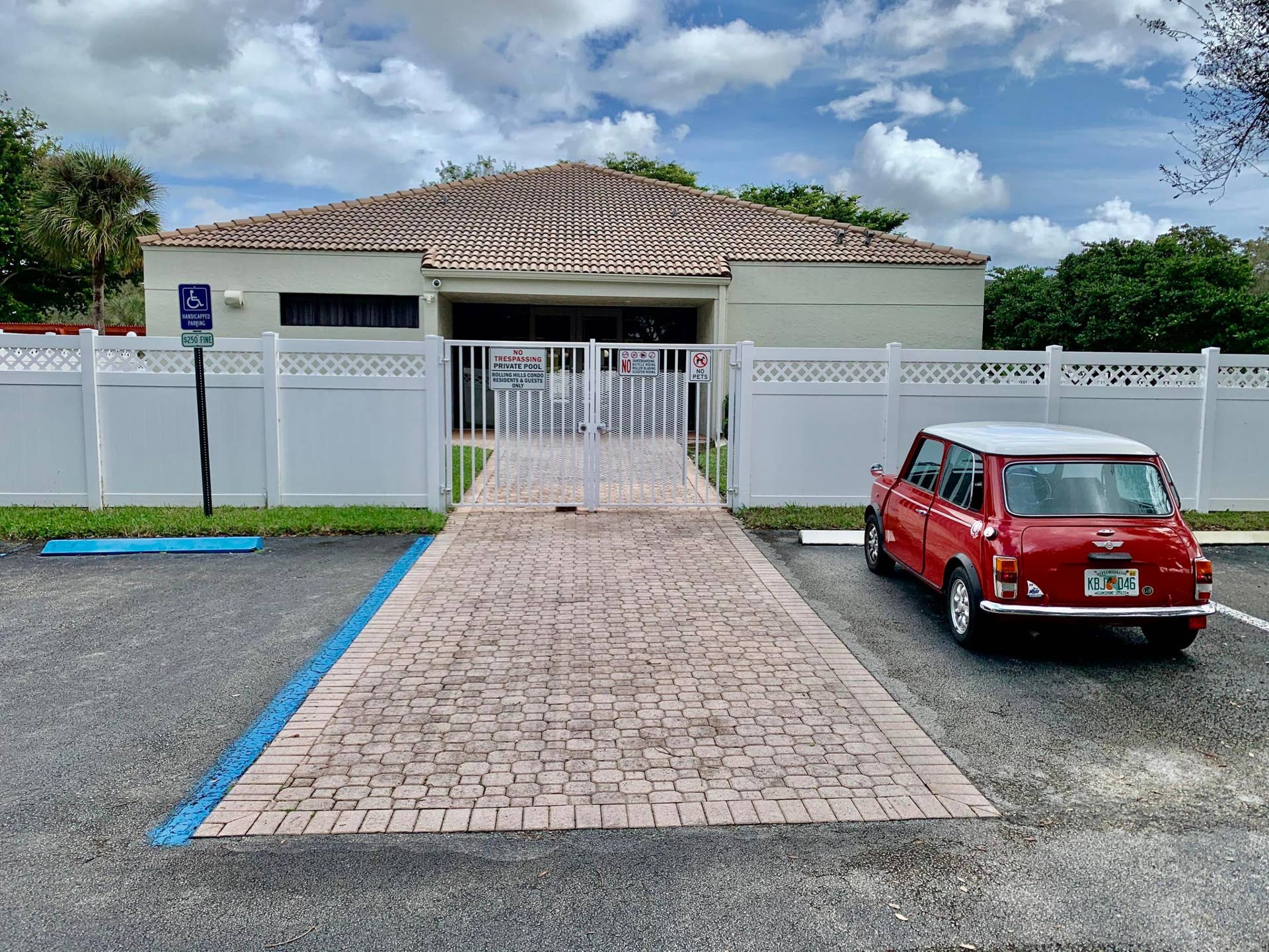 3100 W Rolling Hills Circle, #309, Davie, Davie, FL 33328 Exterior building featuring a beige stucco finish and a terracotta tile roof