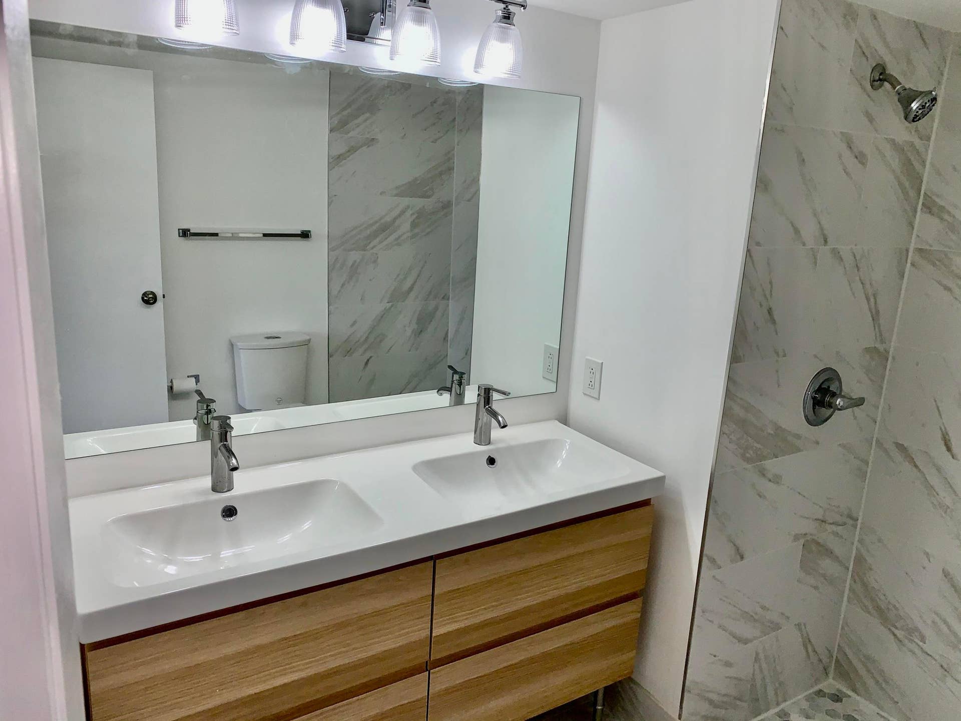 3100 W Rolling Hills Circle, #309, Davie, Davie, FL 33328 Double vanity featuring an integrated white sink, wood-finish cabinetry, and chrome fixtures