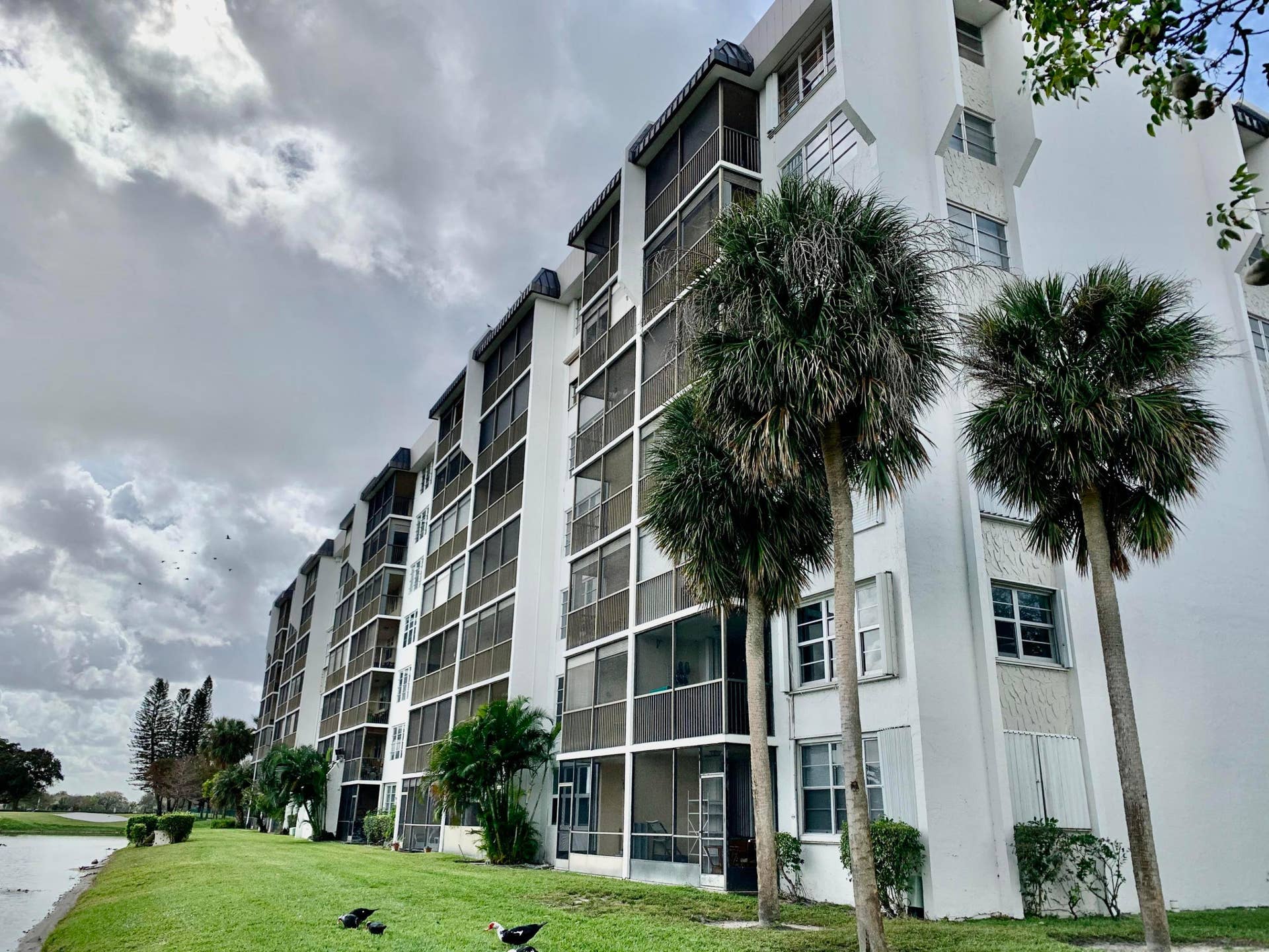 3100 W Rolling Hills Circle, #309, Davie, Davie, FL 33328 Multi-story building featuring white exterior siding