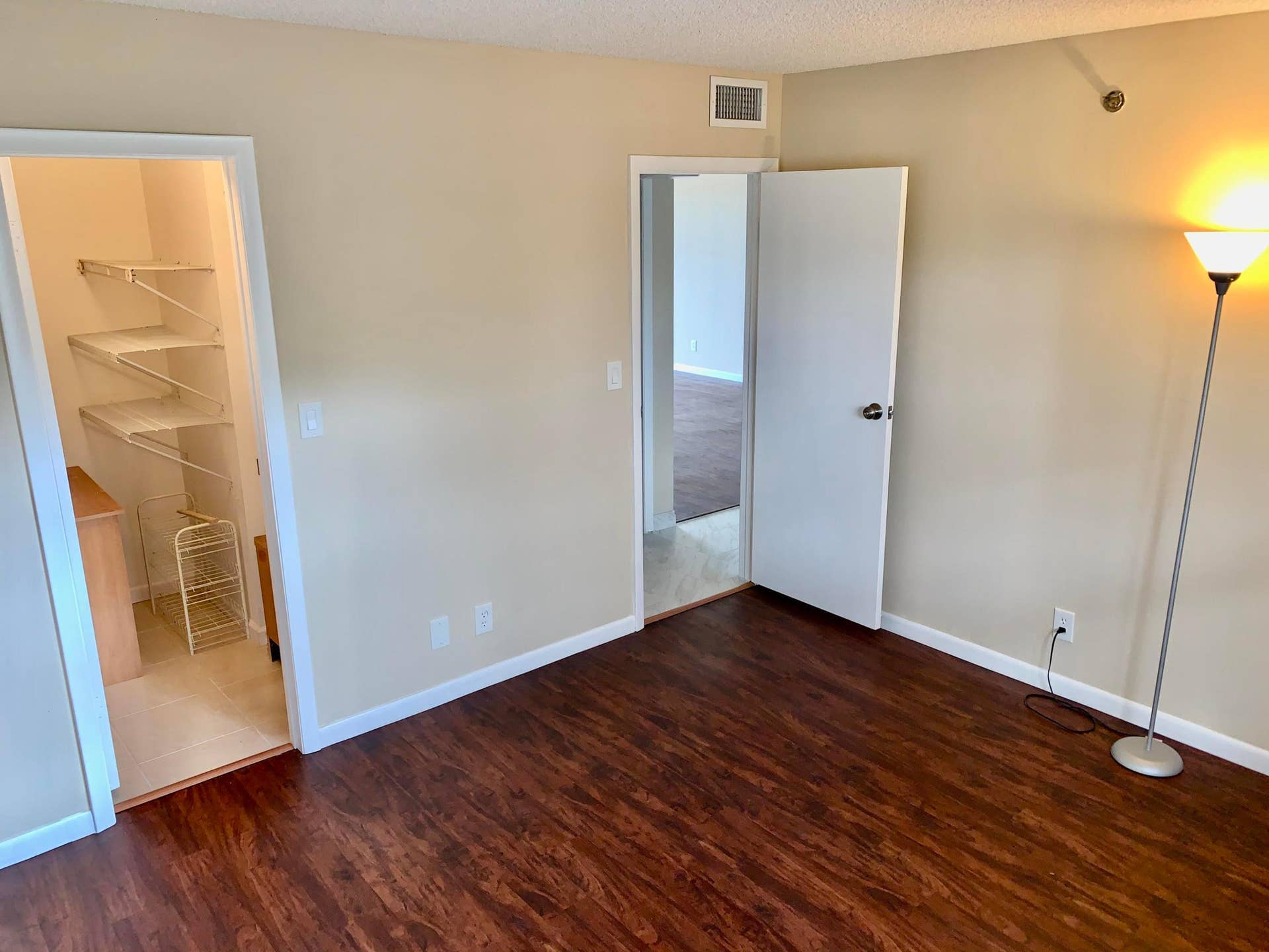 3100 W Rolling Hills Circle, #309, Davie, Davie, FL 33328 Spacious room featuring rich wood-finish flooring and neutral wall tones