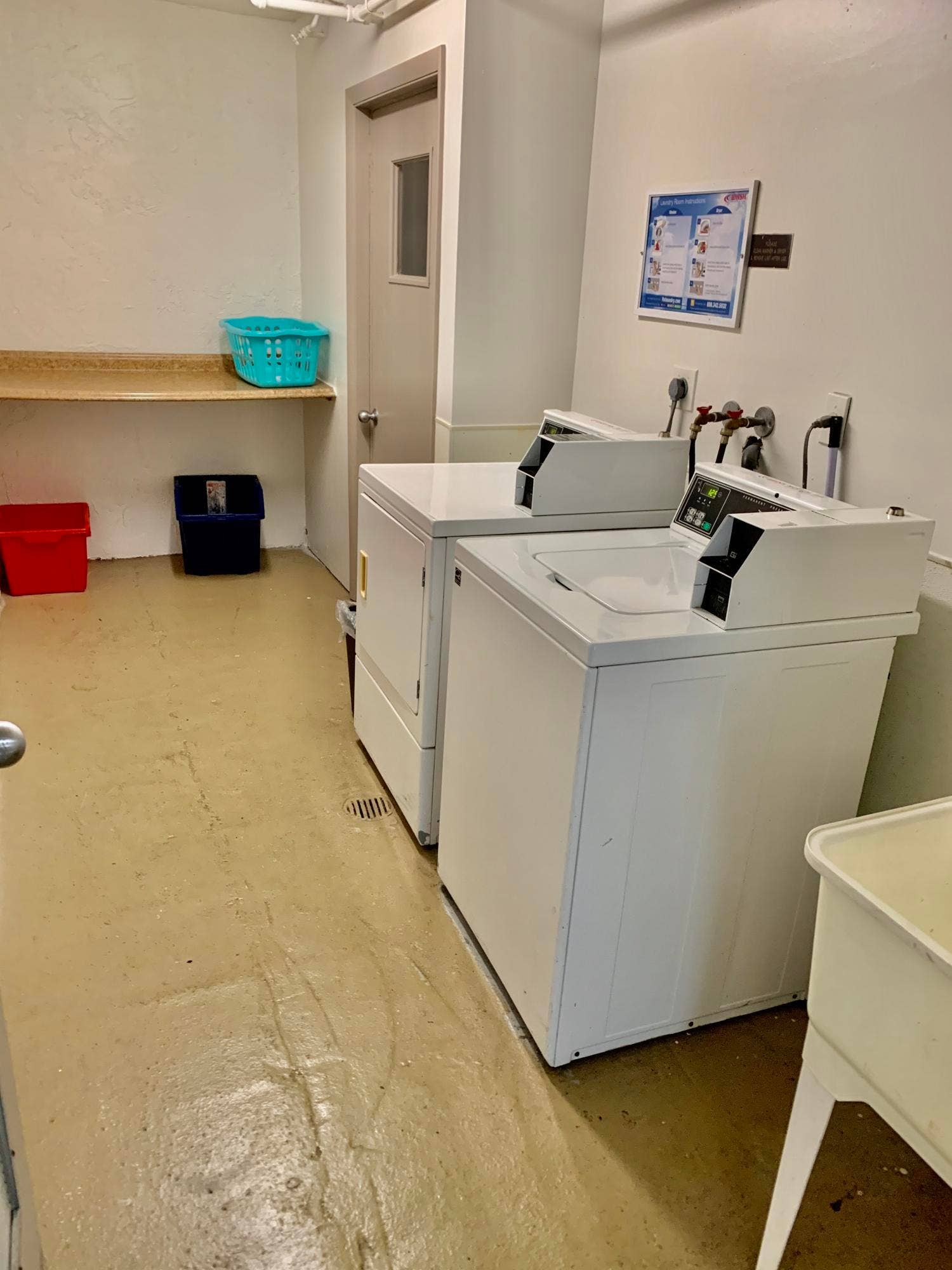 3100 W Rolling Hills Circle, #309, Davie, Davie, FL 33328 Dedicated laundry area featuring white top-load washing machines, a utility sink, and a wall-mounted shelving unit