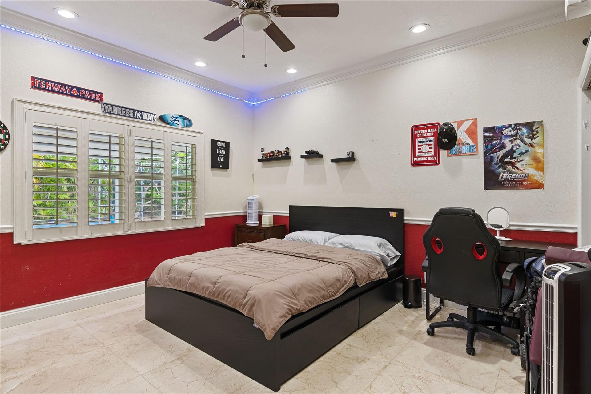 Room featuring a window with white louvered shutters, crown molding, recessed lighting, and a ceiling fan