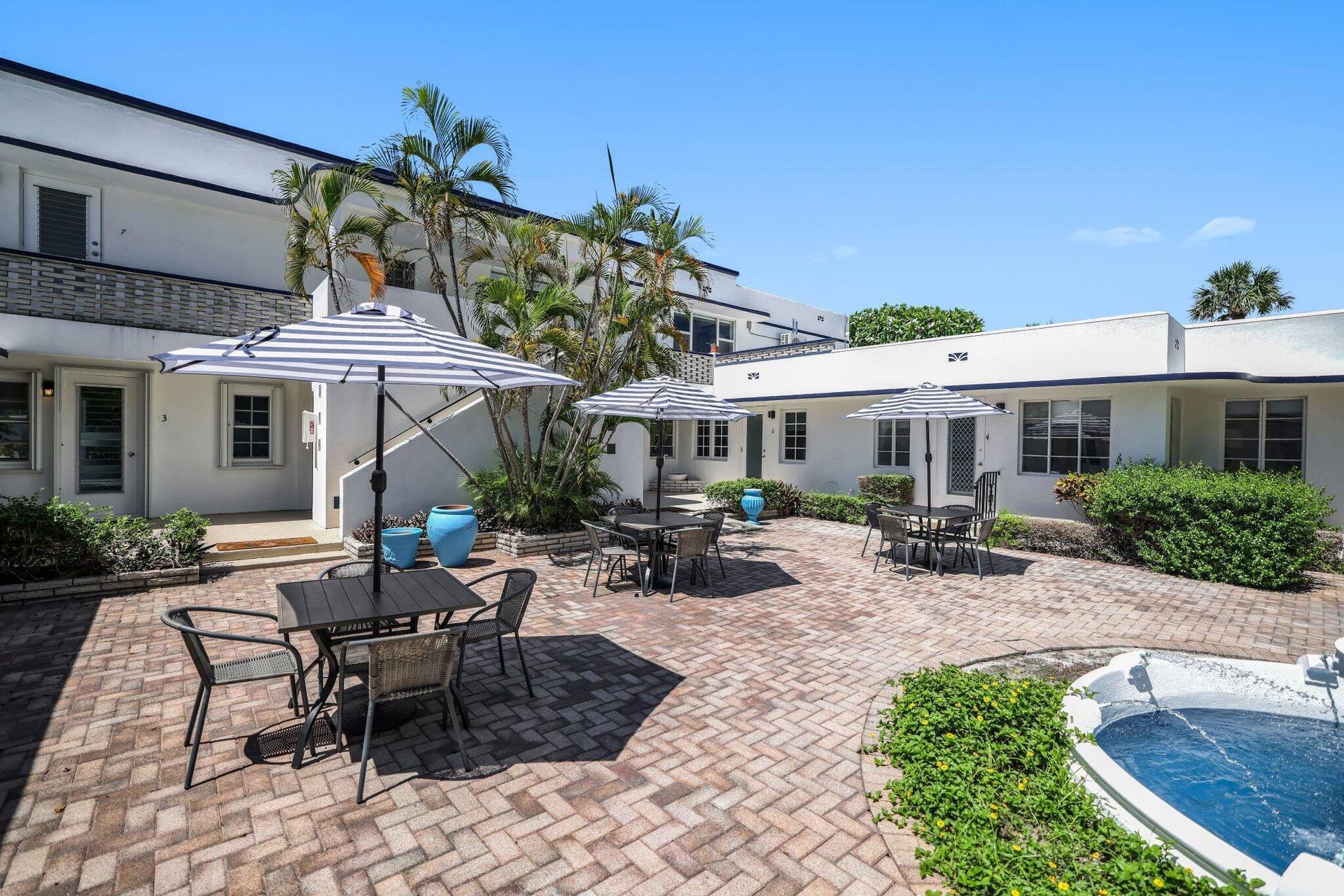 320 Inlet Way, #4, Palm Beach Shores, Palm Beach Shores, FL 33404 Courtyard area with brick paver flooring and a built-in water feature