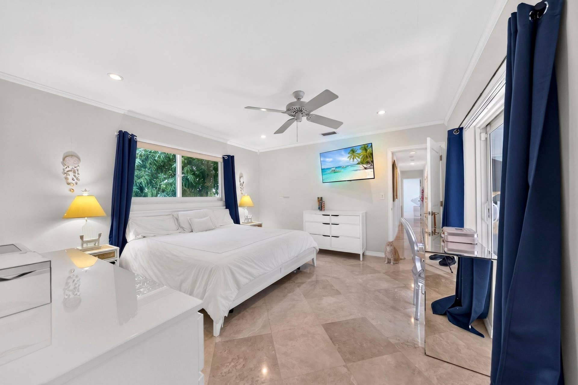 Spacious MBR featuring marble flooring, a large window, recessed lighting, and a ceiling fan