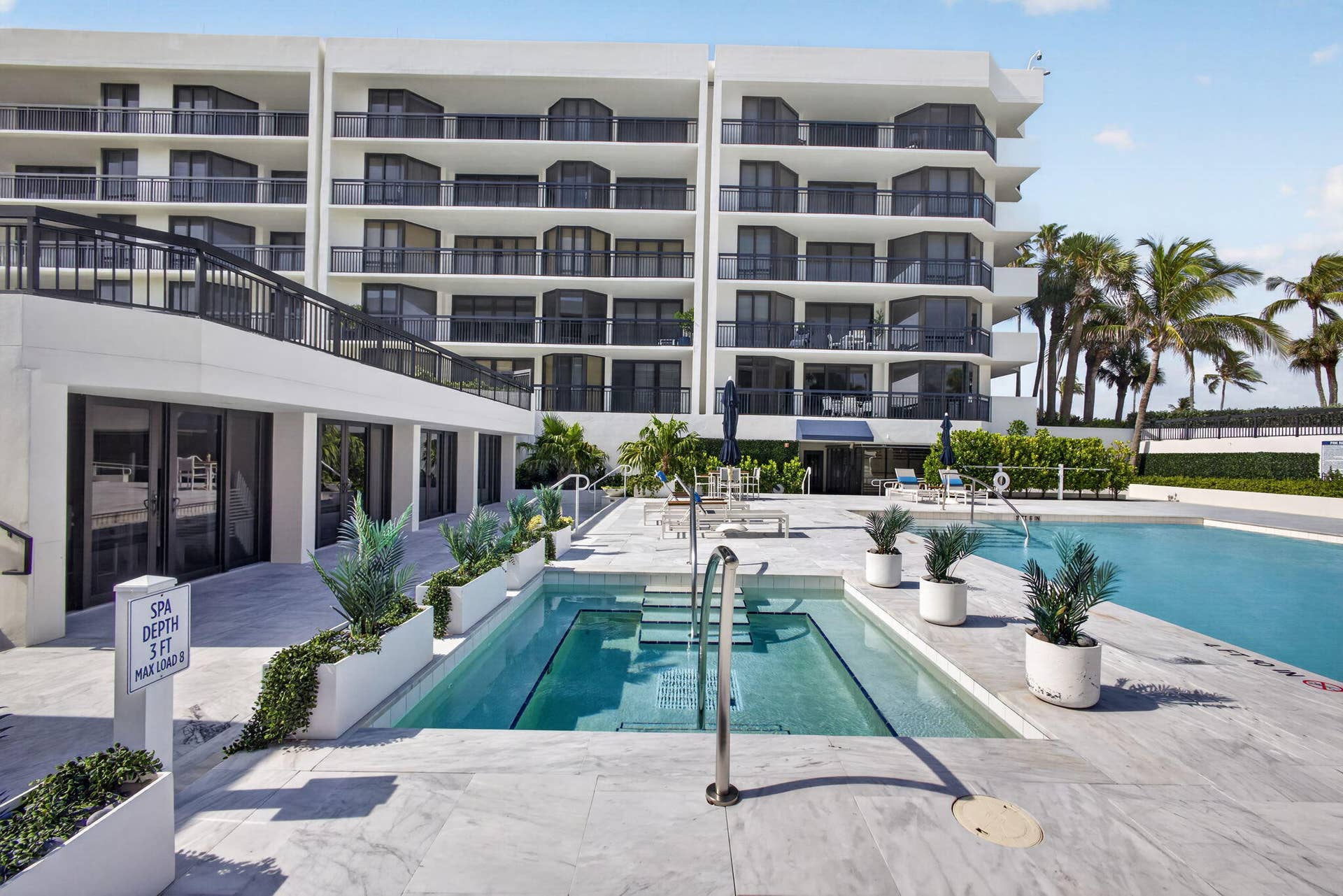 3140 S Ocean Boulevard, #101 S, Palm Beach, FL 33480 Resort-style pool deck featuring a swimming pool, spa, and ample lounging space