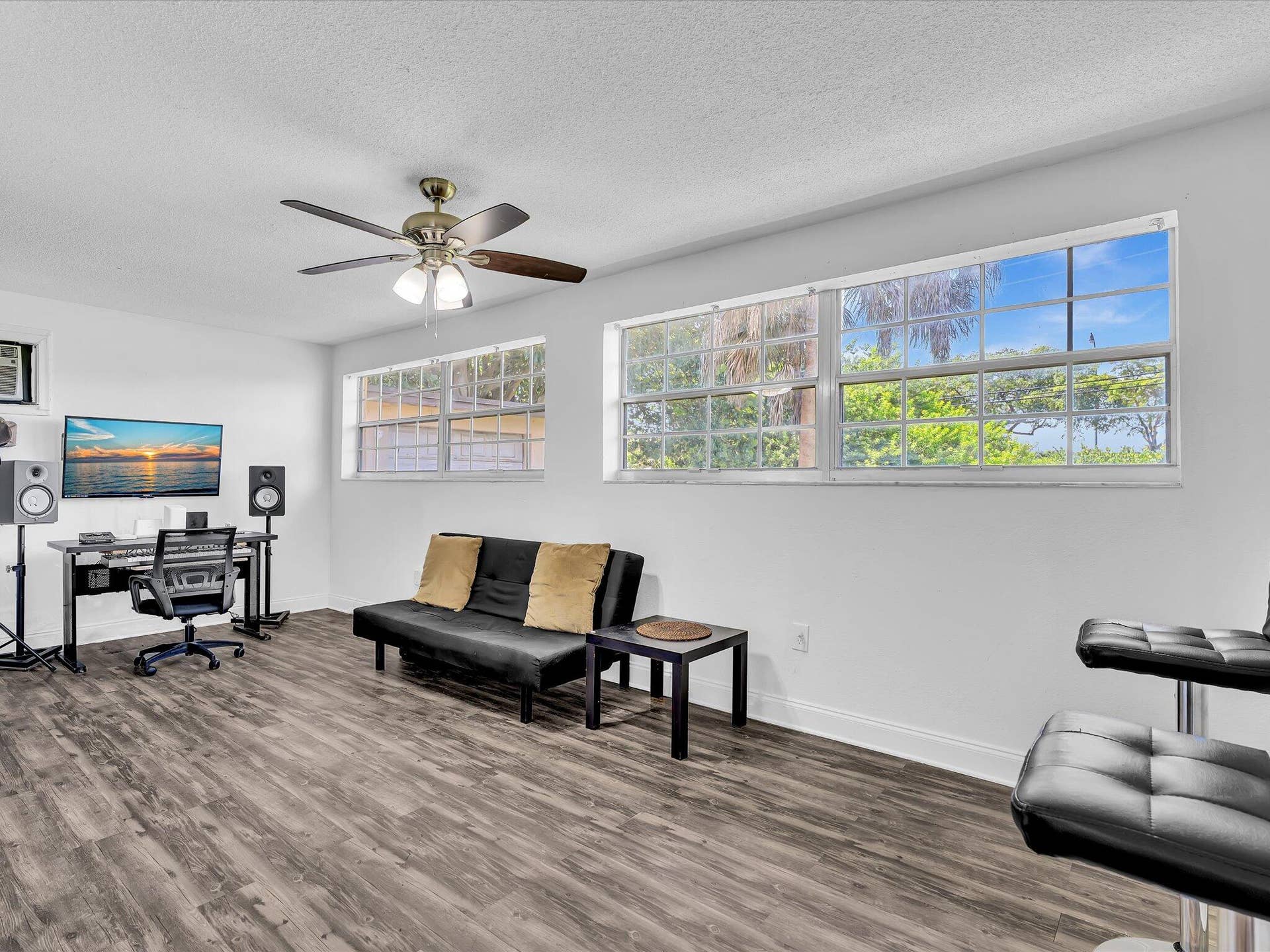Spacious attached studio wing featuring a private entrance, closet, and full en-suite bath.