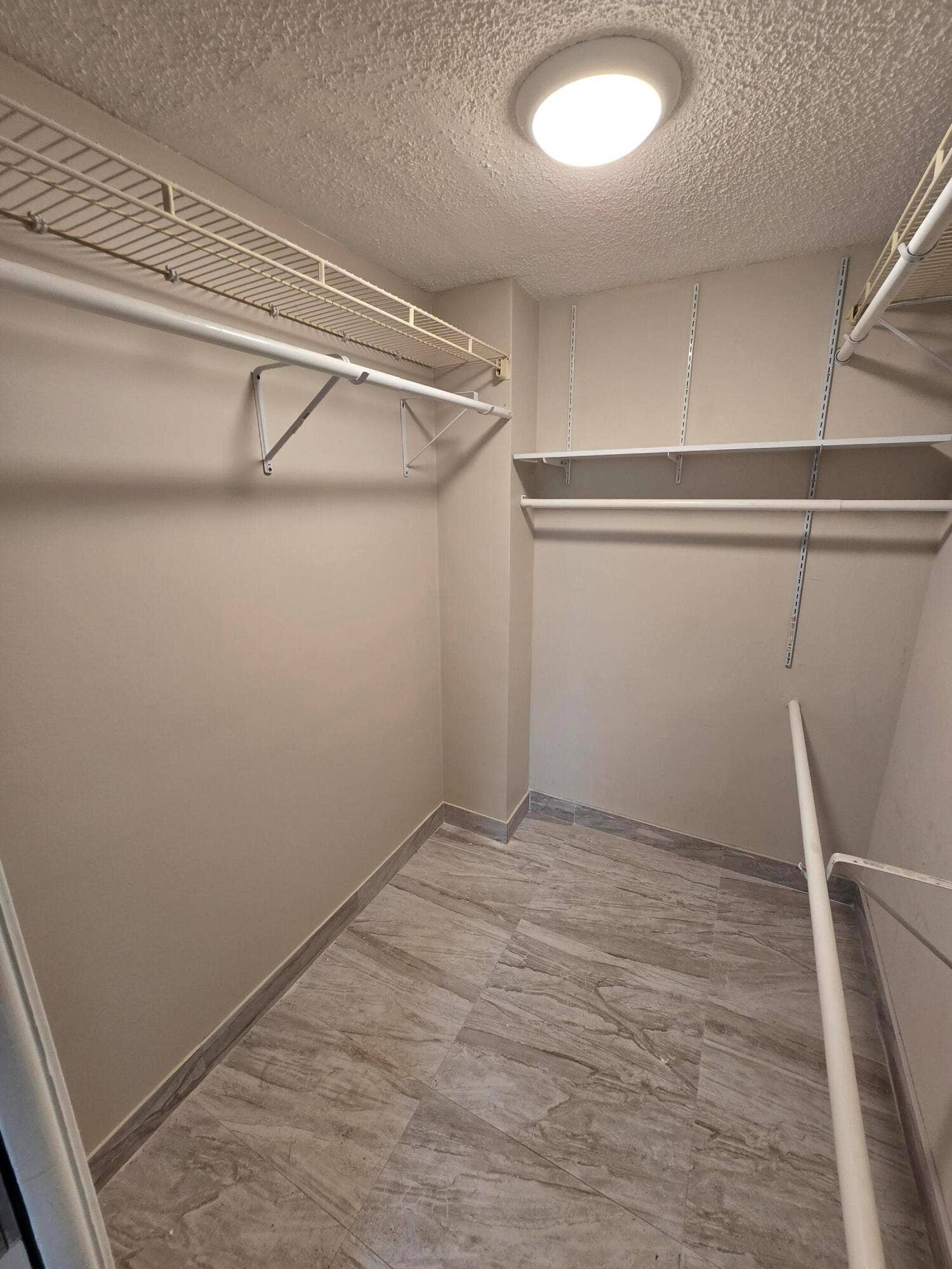PRIMARY BEDROOM WALK-IN CLOSET