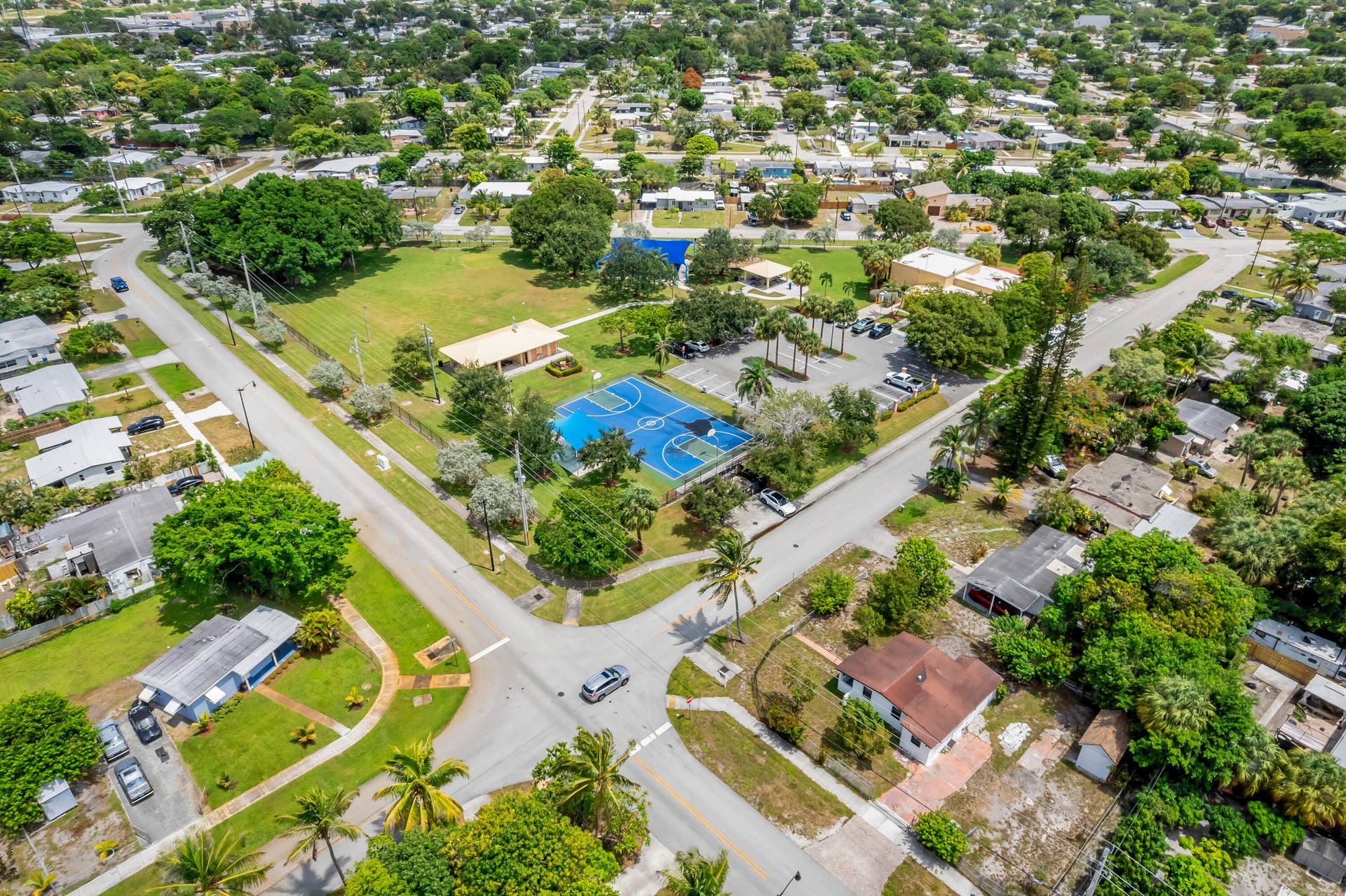 Aerial perspective showcasing a residential area with various properties and surrounding features