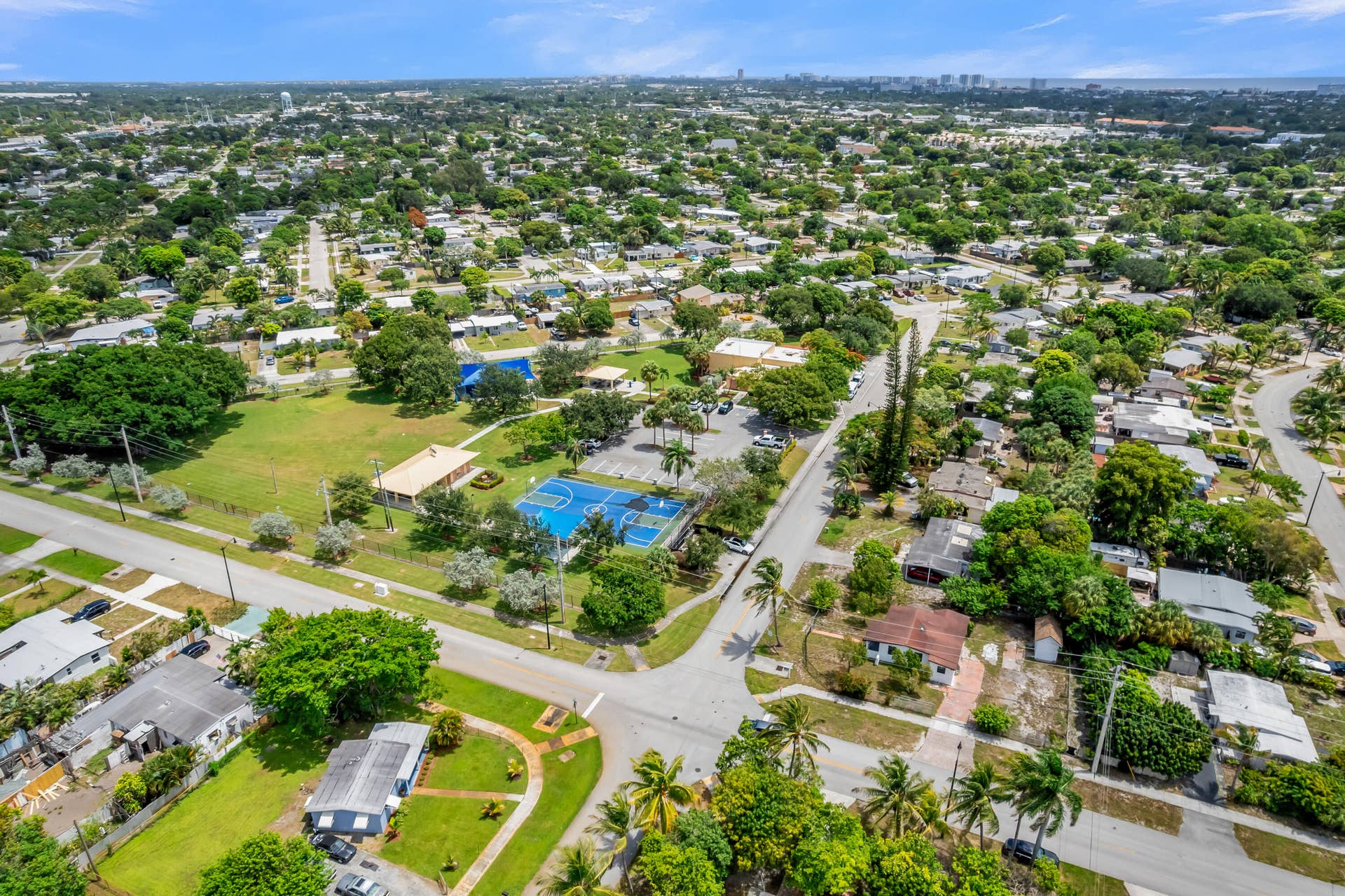 Expansive aerial view showcasing a residential area with lush green spaces