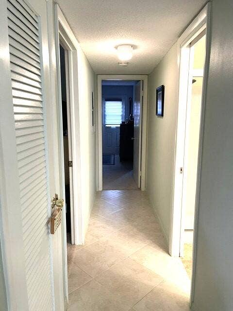 237 HIGH POINT Court W, #A, Delray Beach, FL 33445 Hallway leading to bedrooms