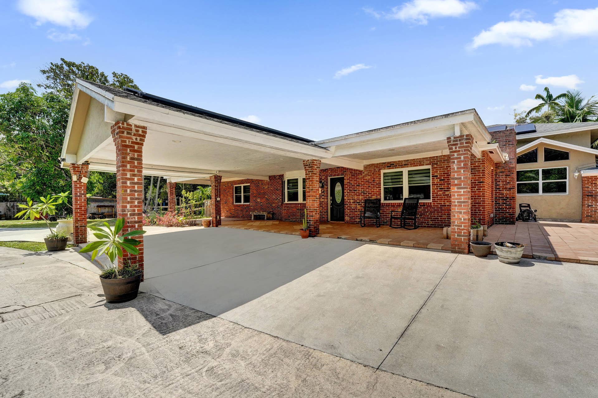 Porte-cochere leads to front porch and entrance of main house