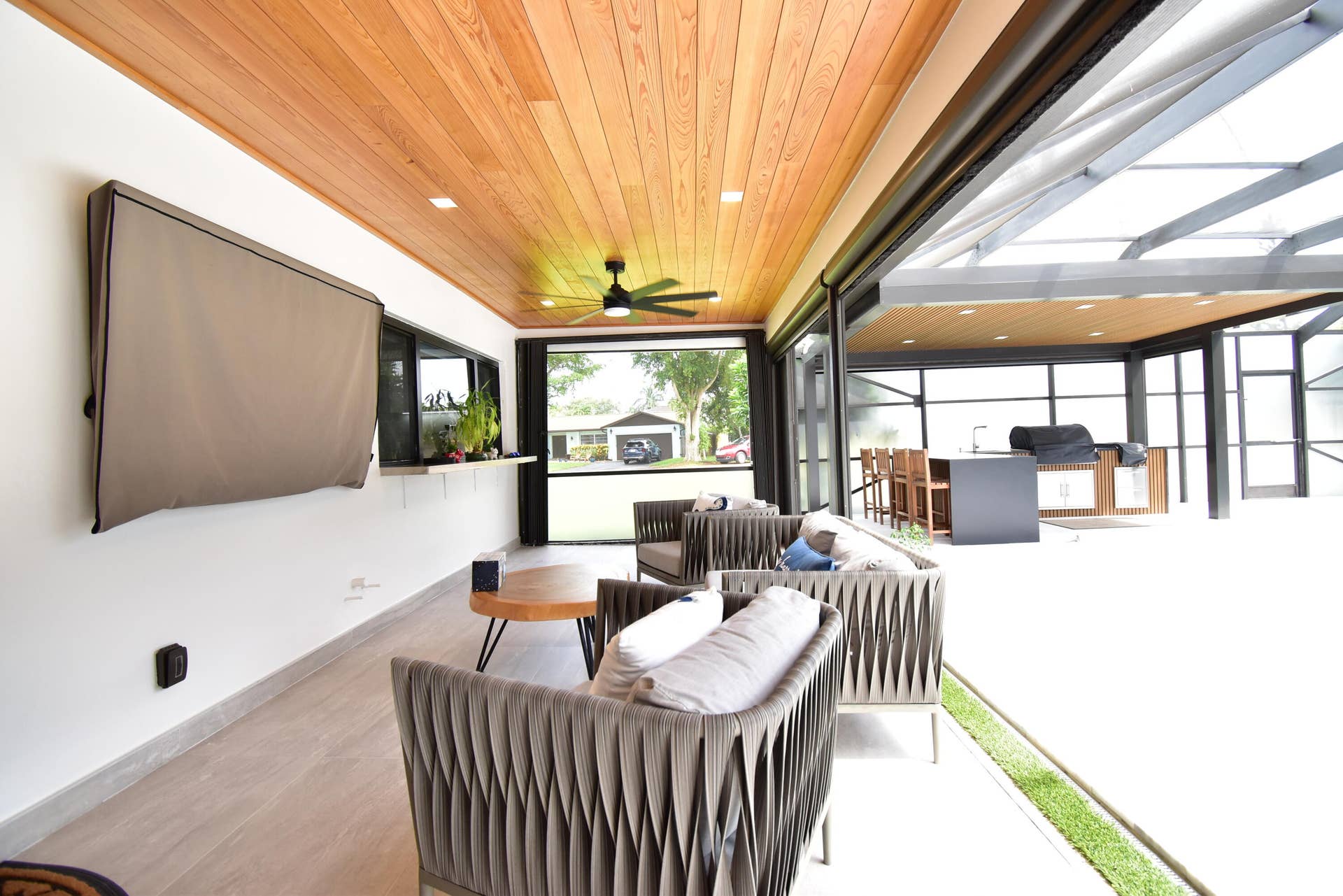 5061 SW 87TH Terrace, Cooper City, FL 33328 Expansive covered patio featuring a wood-finish ceiling, recessed lighting, and a ceiling fan