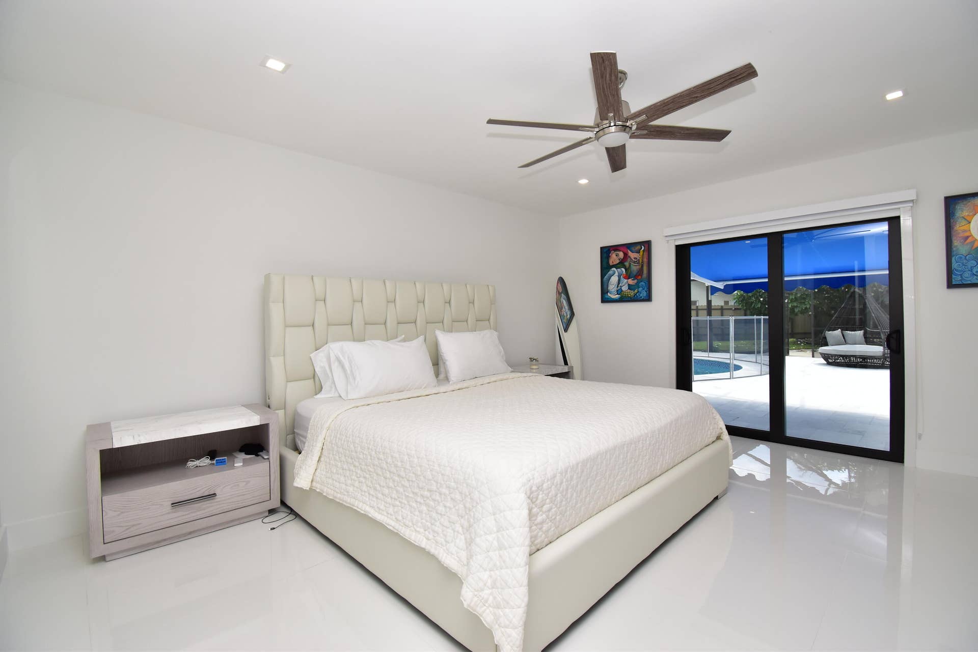 5061 SW 87TH Terrace, Cooper City, FL 33328 Recessed lighting illuminates this bright room featuring a ceiling fan, sliding glass doors, and a private patio with a pool