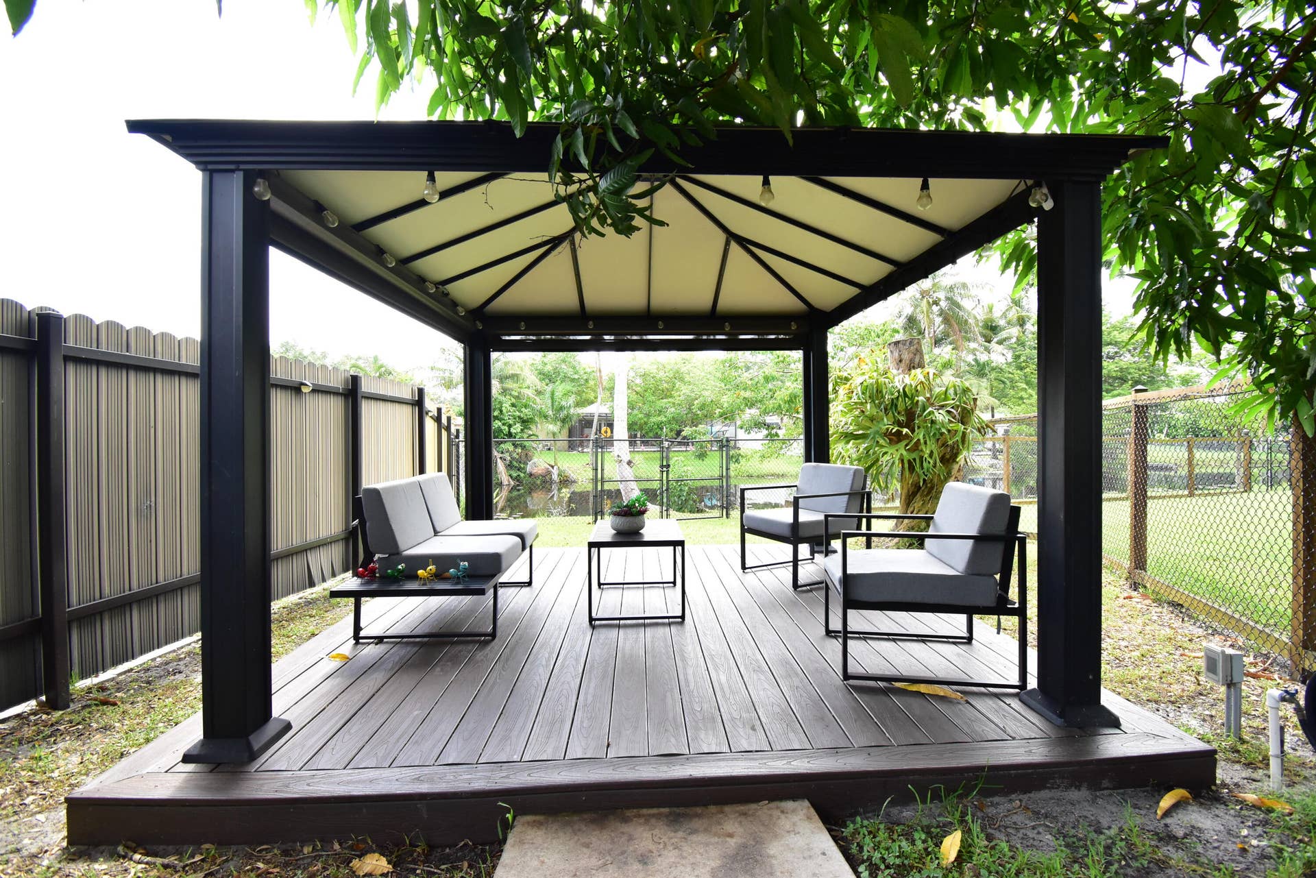 5061 SW 87TH Terrace, Cooper City, FL 33328 Outdoor gazebo featuring a black metal frame and light-colored canopy