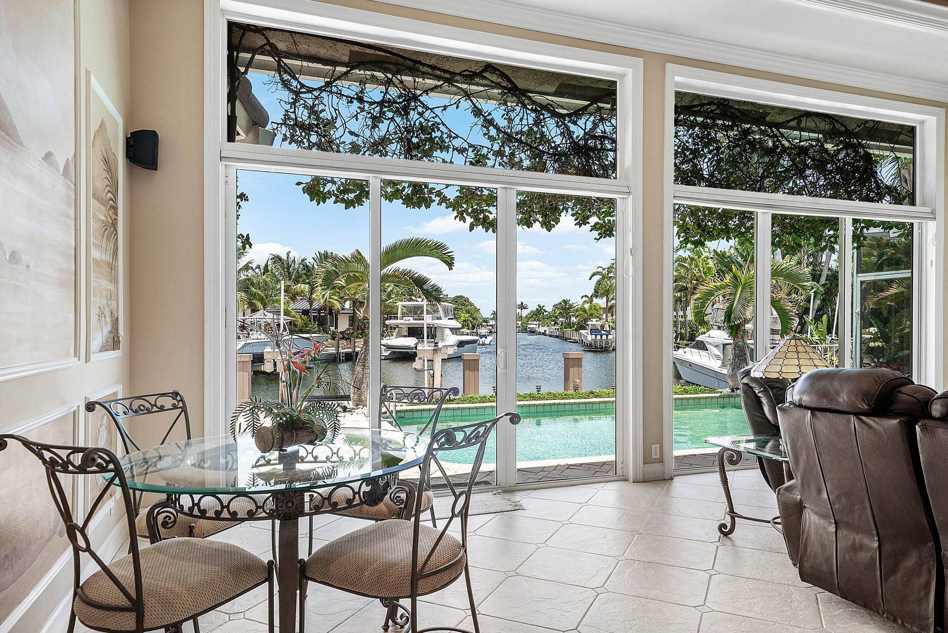 2761 NE 48TH Court, Lighthouse Point, FL 33064 Spacious interior with large windows providing extensive water frontage