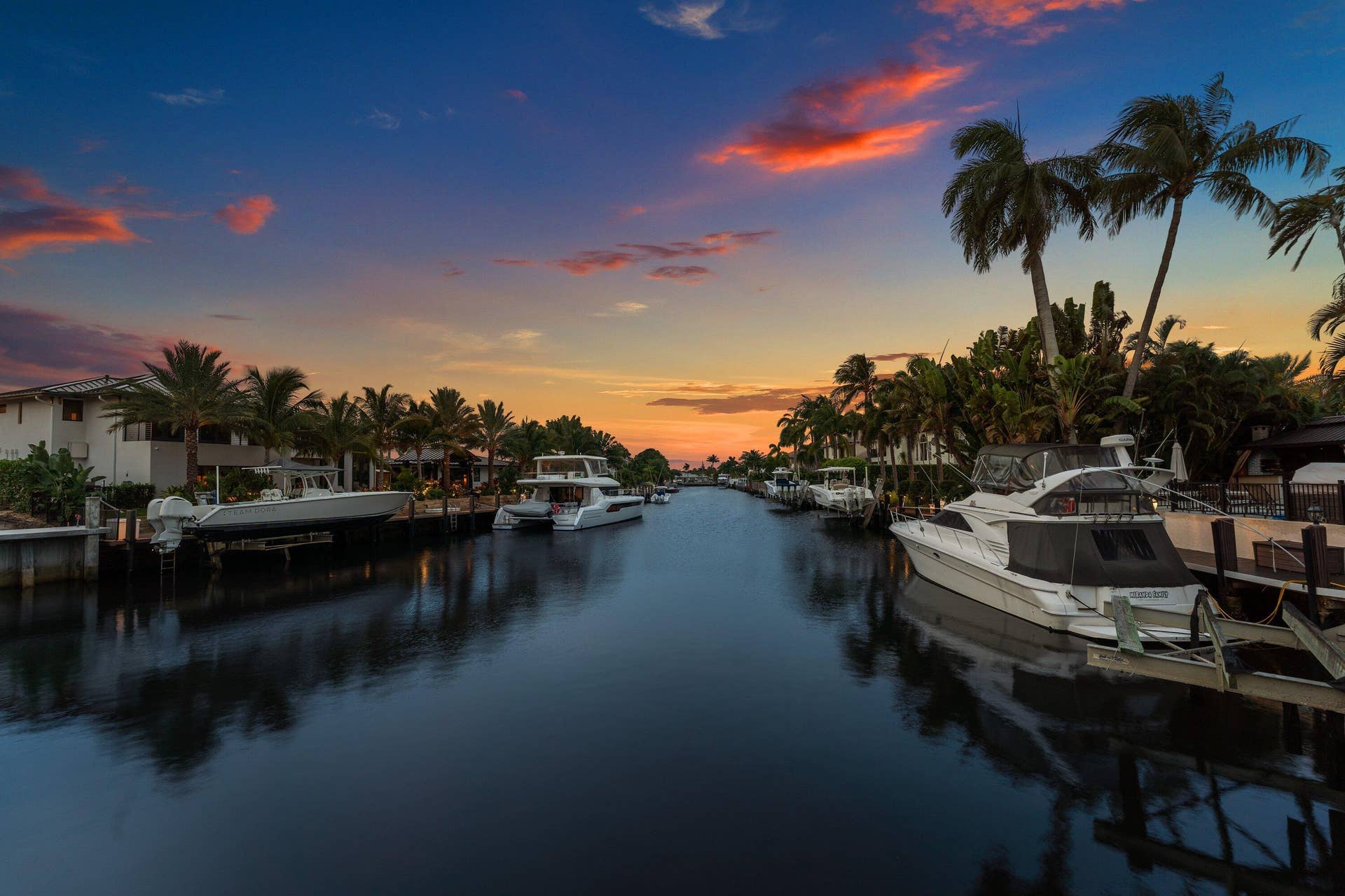 2761 NE 48TH Court, Lighthouse Point, FL 33064 Waterfront canal featuring private docks and mature palm trees