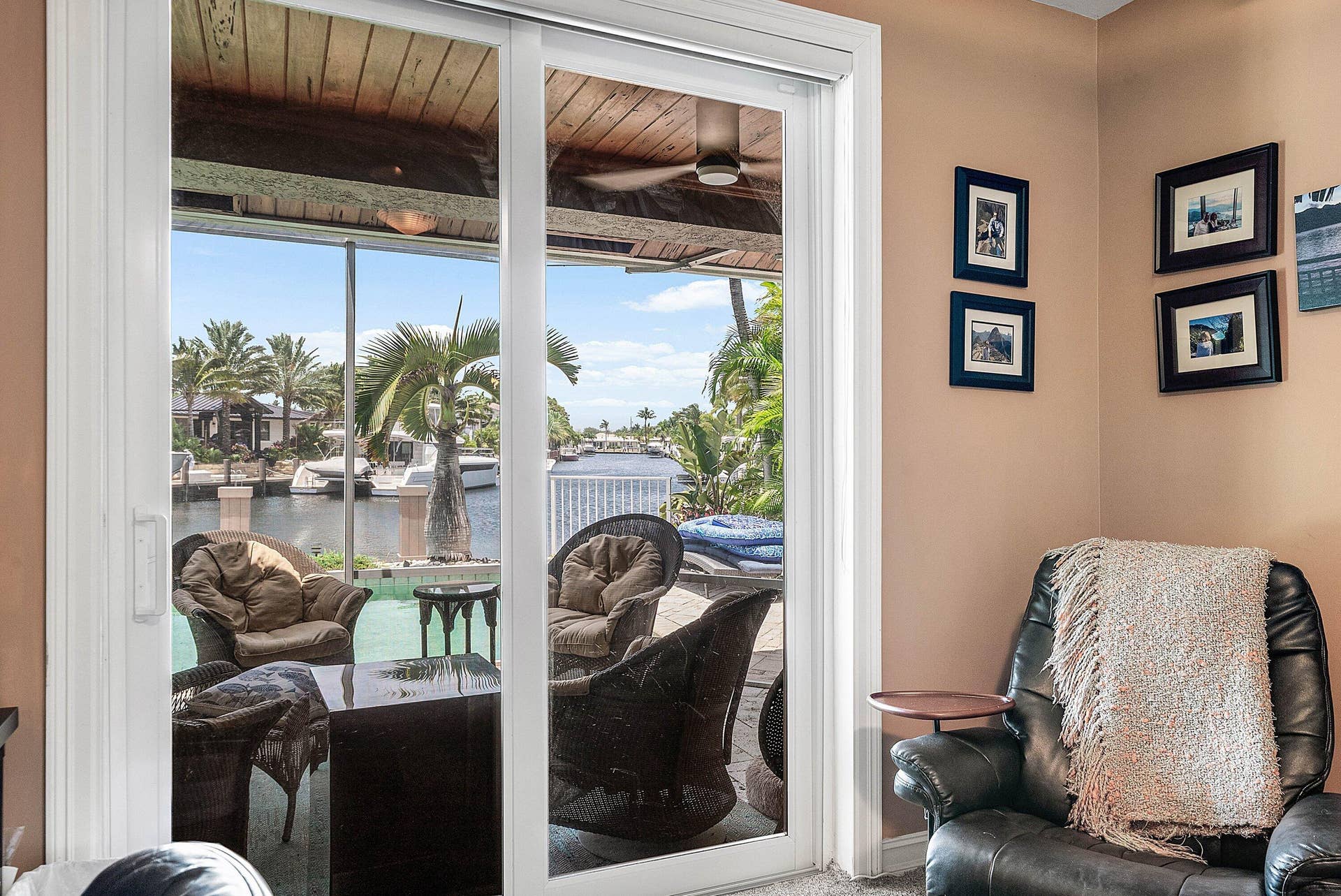 2761 NE 48TH Court, Lighthouse Point, FL 33064 Sliding glass doors opening to an outdoor patio with waterfront access