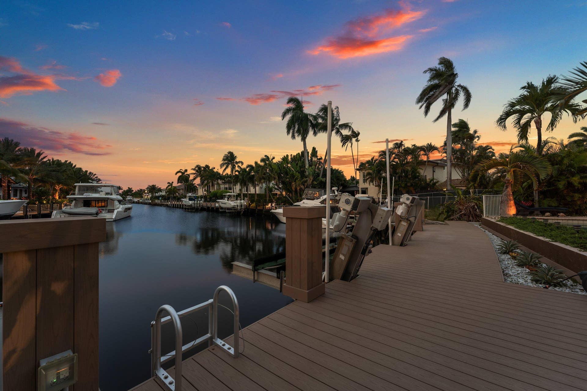 2761 NE 48TH Court, Lighthouse Point, FL 33064 Waterside composite decking featuring multiple boat lifts and direct canal access