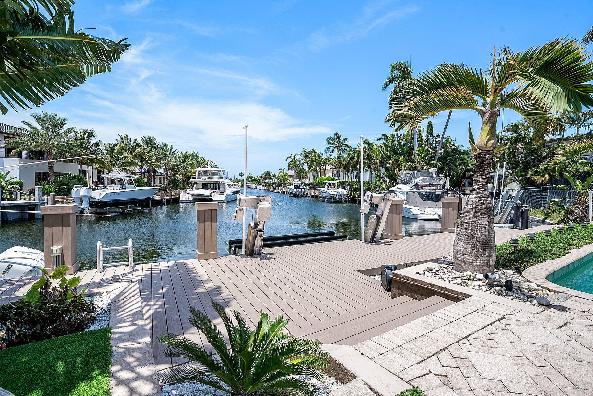 2761 NE 48TH Court, Lighthouse Point, FL 33064 Waterfront dock with a composite decking surface, boat lift, and power pedestals