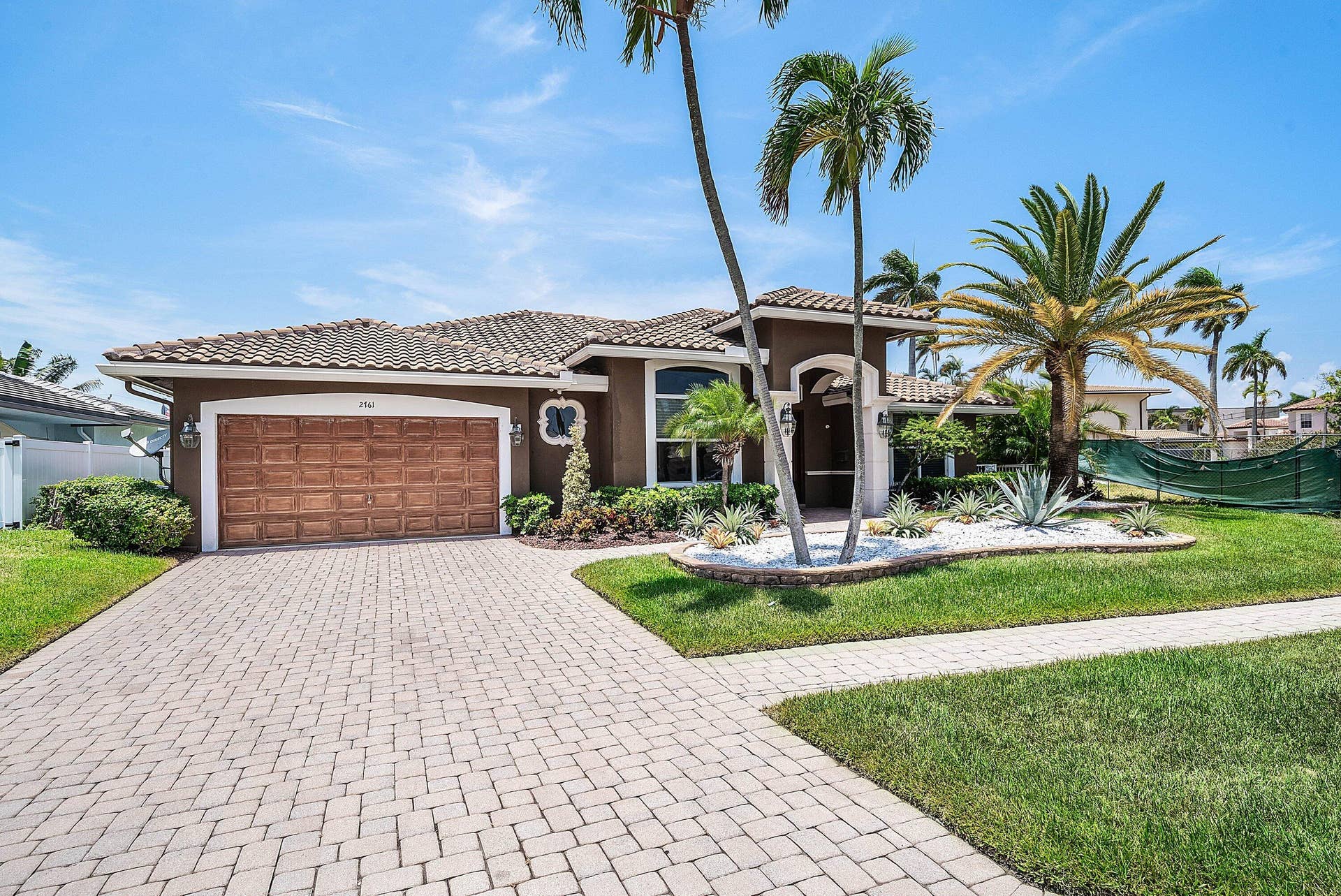 2761 NE 48TH Court, Lighthouse Point, FL 33064 Contemporary stucco exterior with a tiled roof