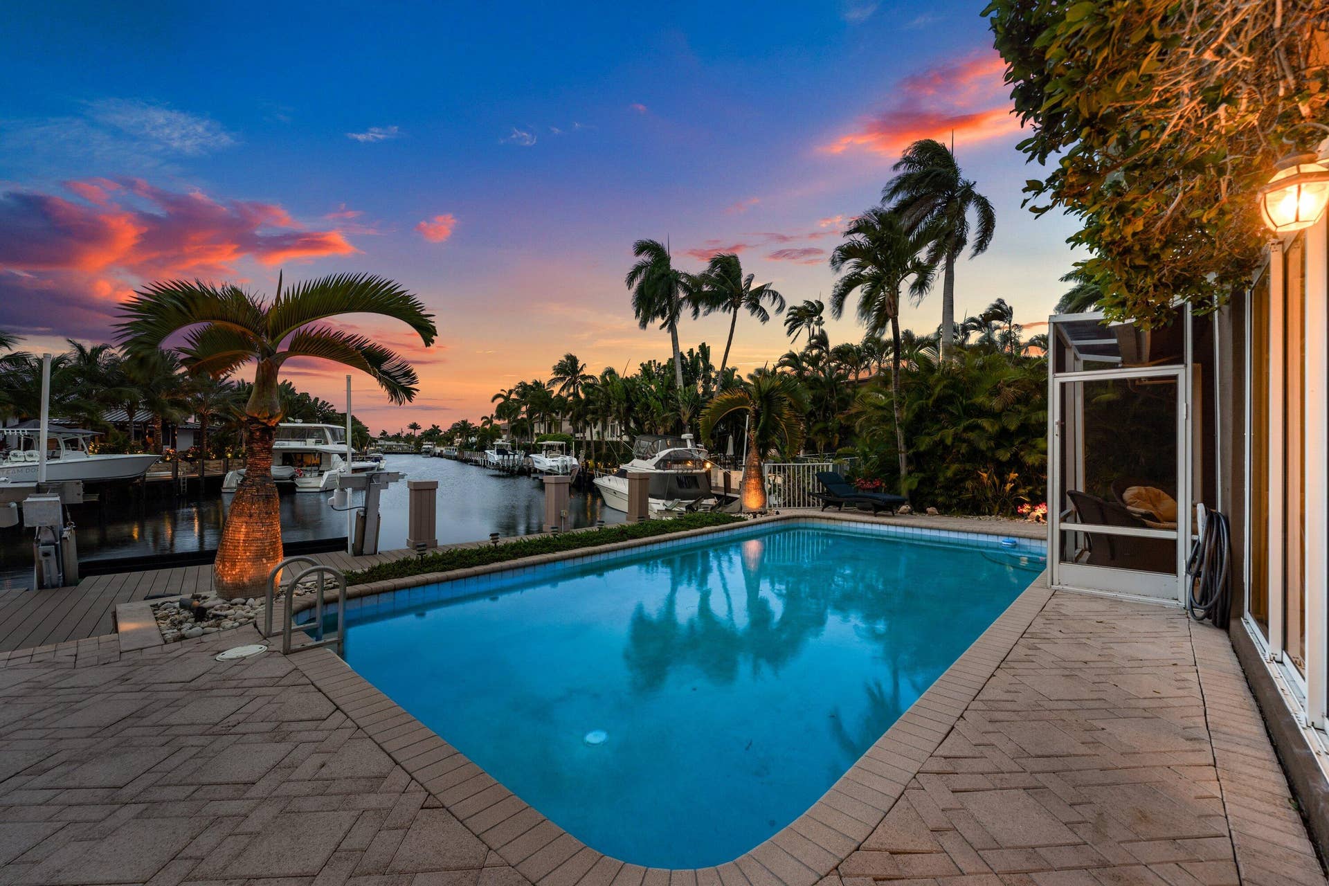 2761 NE 48TH Court, Lighthouse Point, FL 33064 Swimming pool with paver decking and integrated lighting