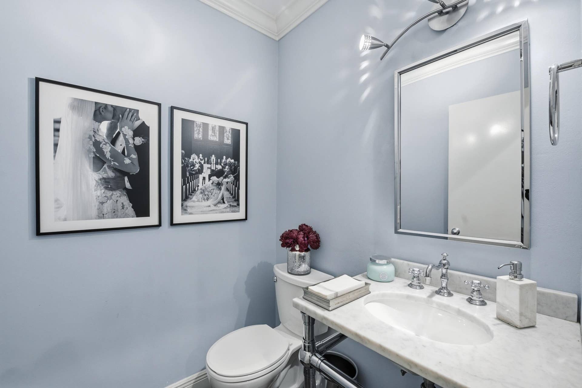 917 NE 3RD Street, #9, Fort Lauderdale, Fort Lauderdale, FL 33301 Powder room featuring a rectangular mirror with a chrome frame, a sleek vanity light fixture, and a white porcelain sink set into a marble countertop